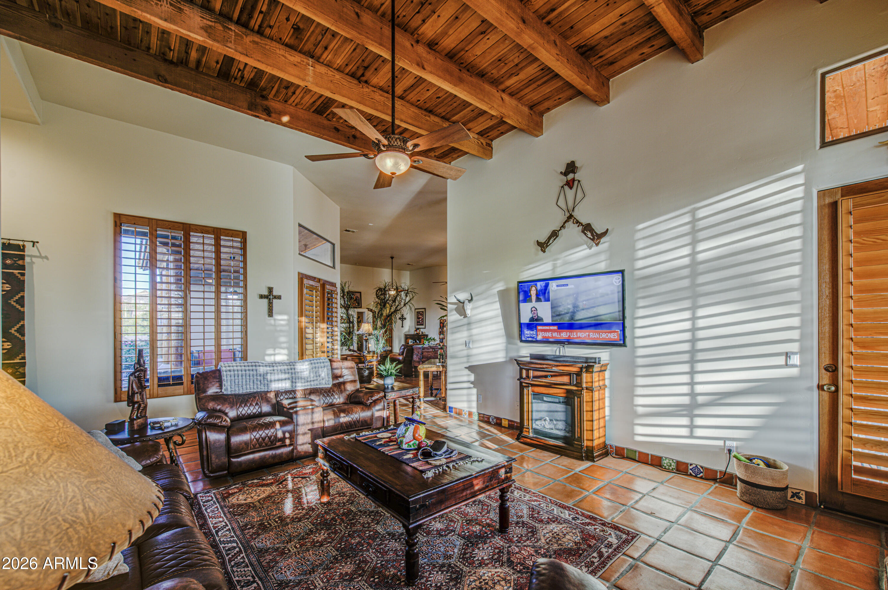 8540 East McDowell Road, Unit 122 Mesa, AZ 85207 - Photo 19 of 75 a living room with fireplace furniture and a window