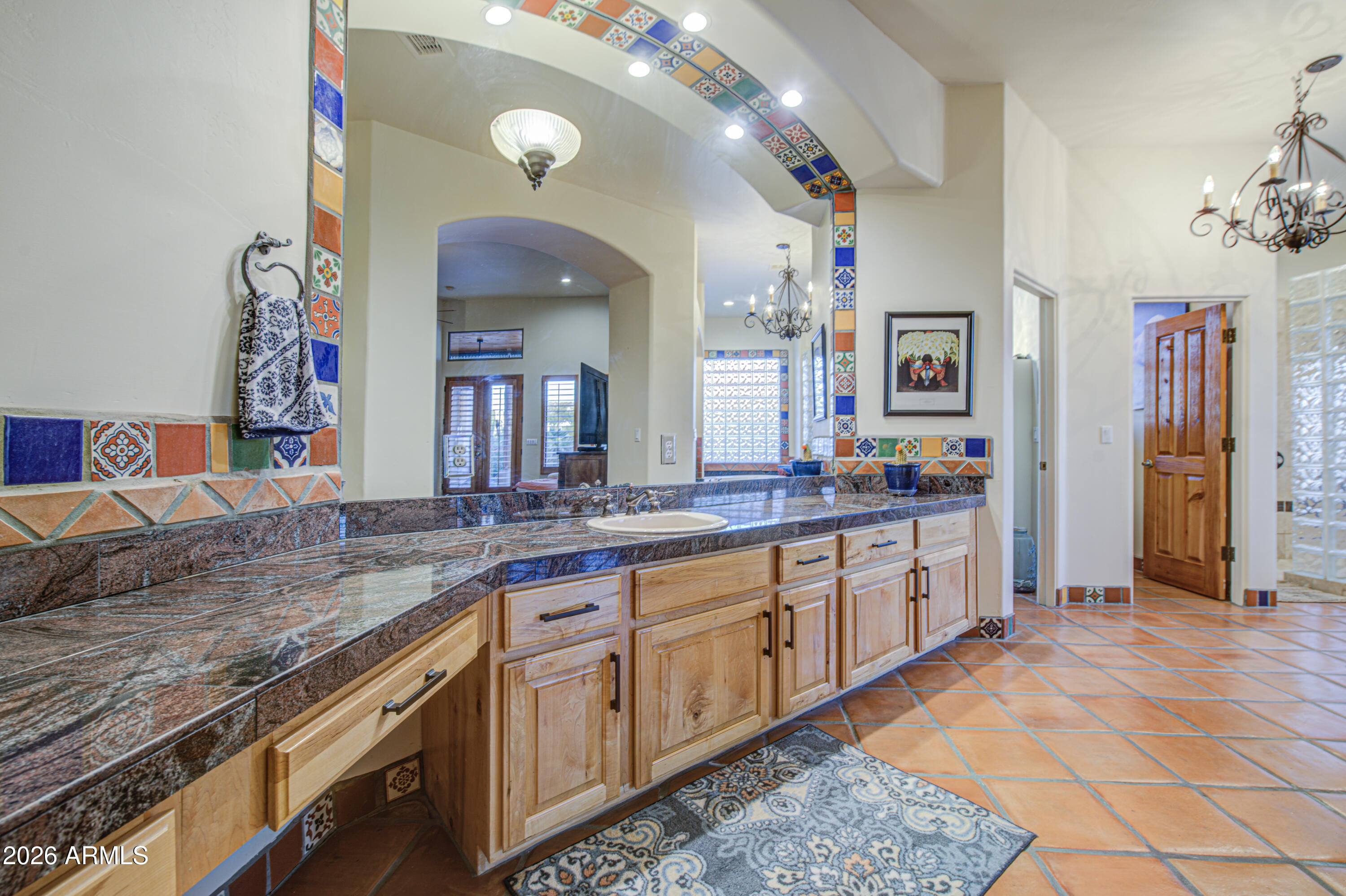 8540 East McDowell Road, Unit 122 Mesa, AZ 85207 - Photo 23 of 75 a spacious bathroom with a granite countertop sink and a mirror