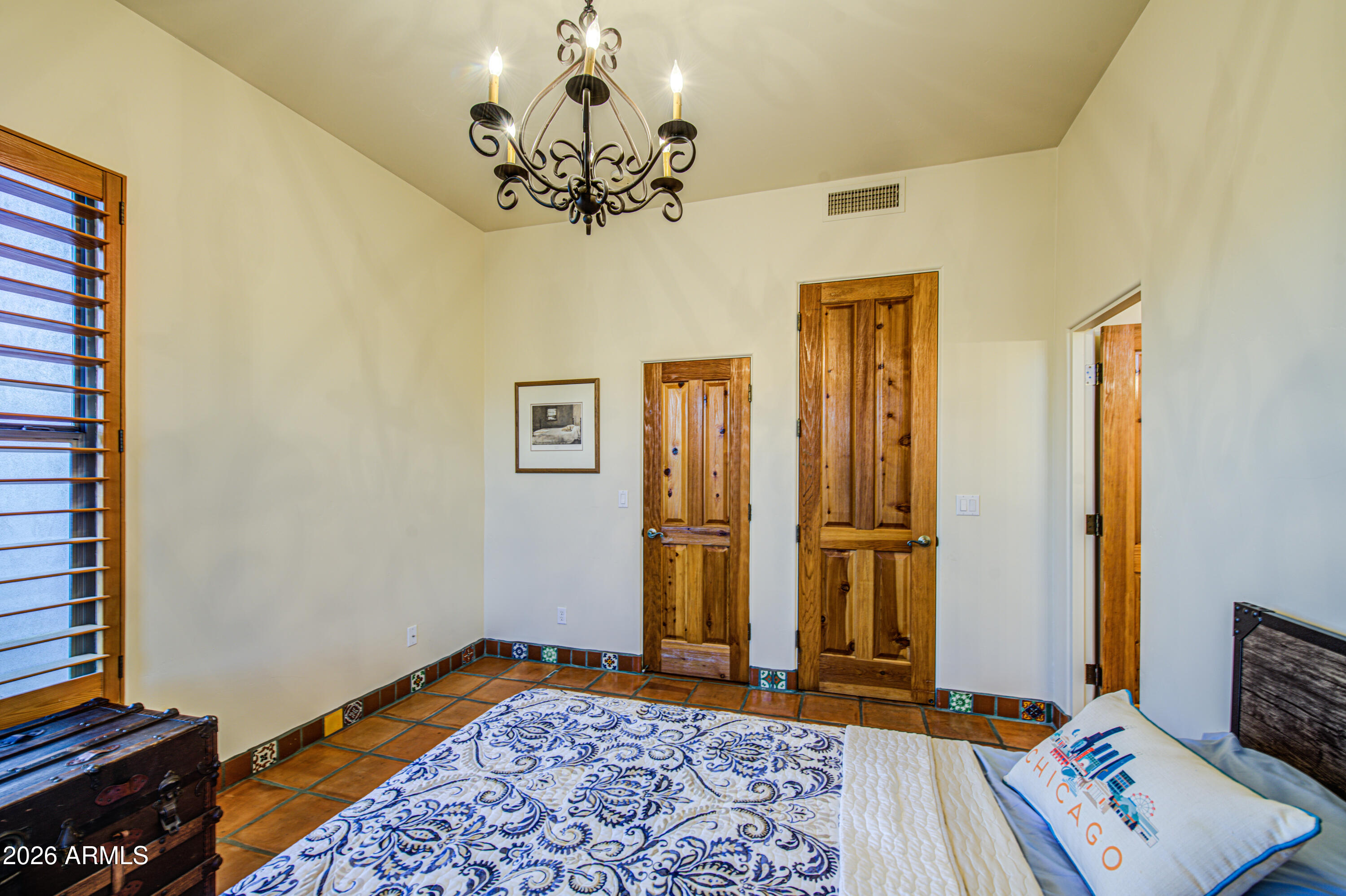 8540 East McDowell Road, Unit 122 Mesa, AZ 85207 - Photo 32 of 75 a bedroom with a bed and a window