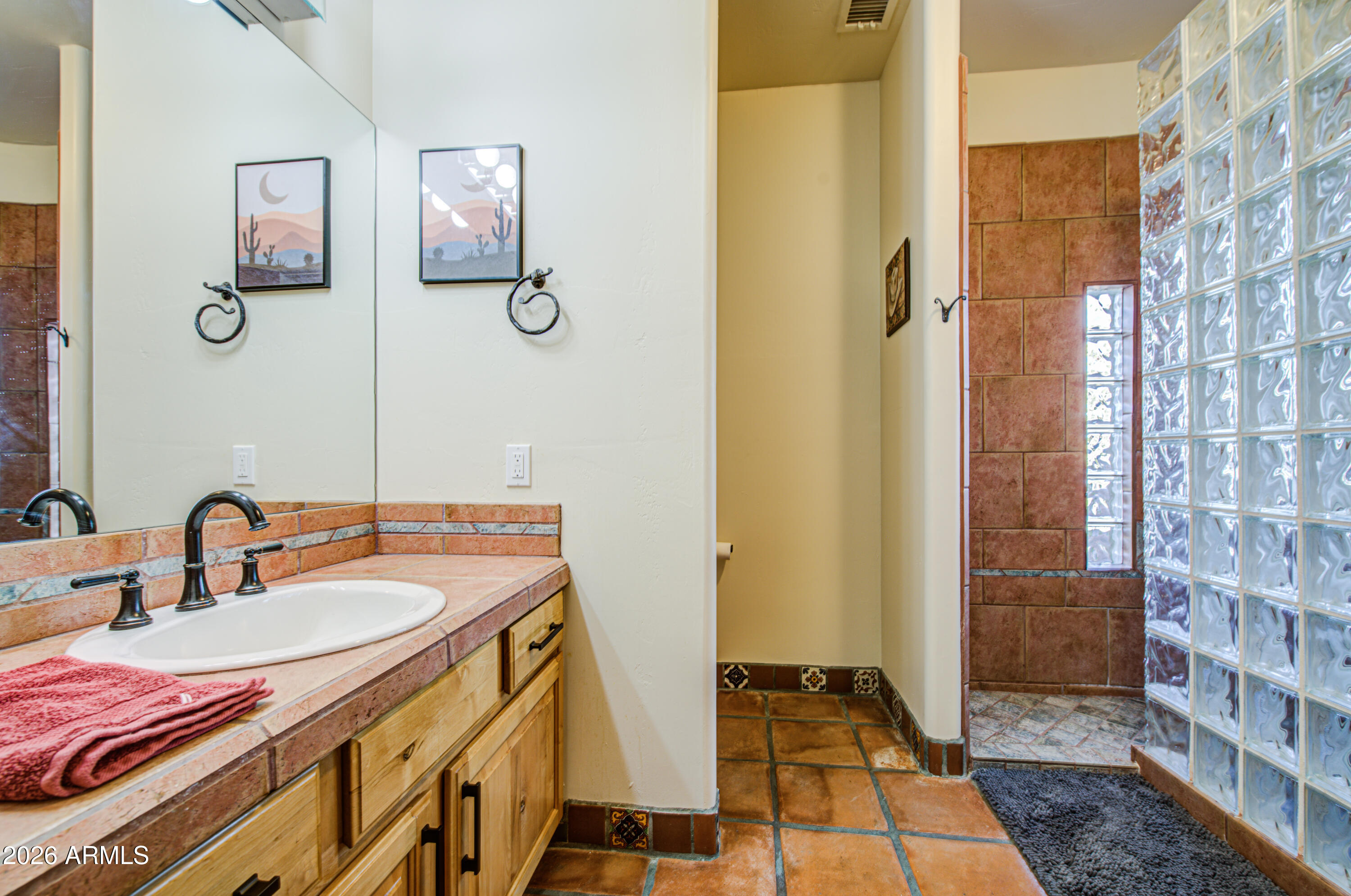 8540 East McDowell Road, Unit 122 Mesa, AZ 85207 - Photo 35 of 75 a bathroom with a sink and a mirror