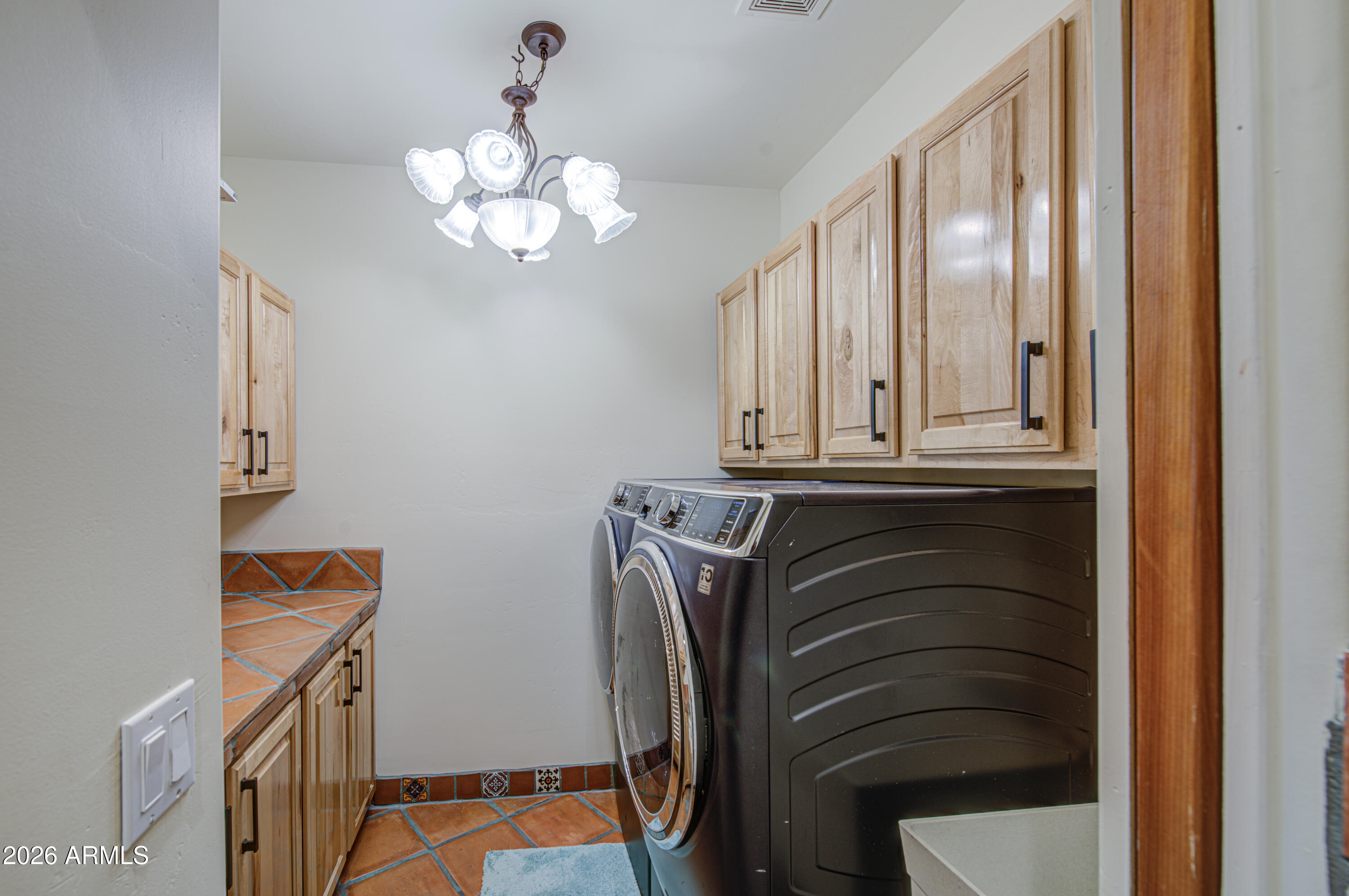 8540 East McDowell Road, Unit 122 Mesa, AZ 85207 - Photo 38 of 75 a view of walk in closet with chandelier