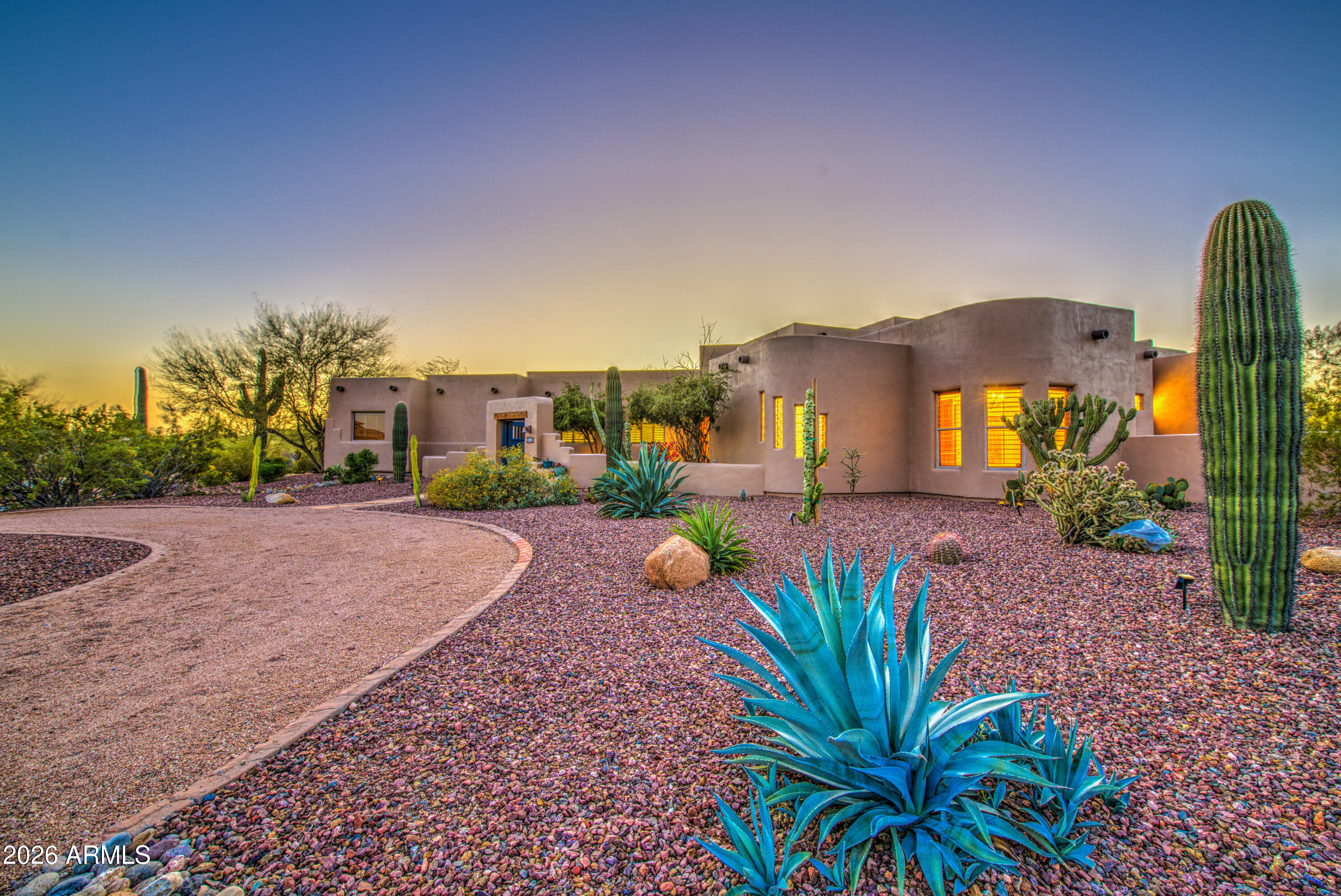 8540 East McDowell Road, Unit 122 Mesa, AZ 85207 - Photo 4 of 75 a view of a house with a yard and potted plants