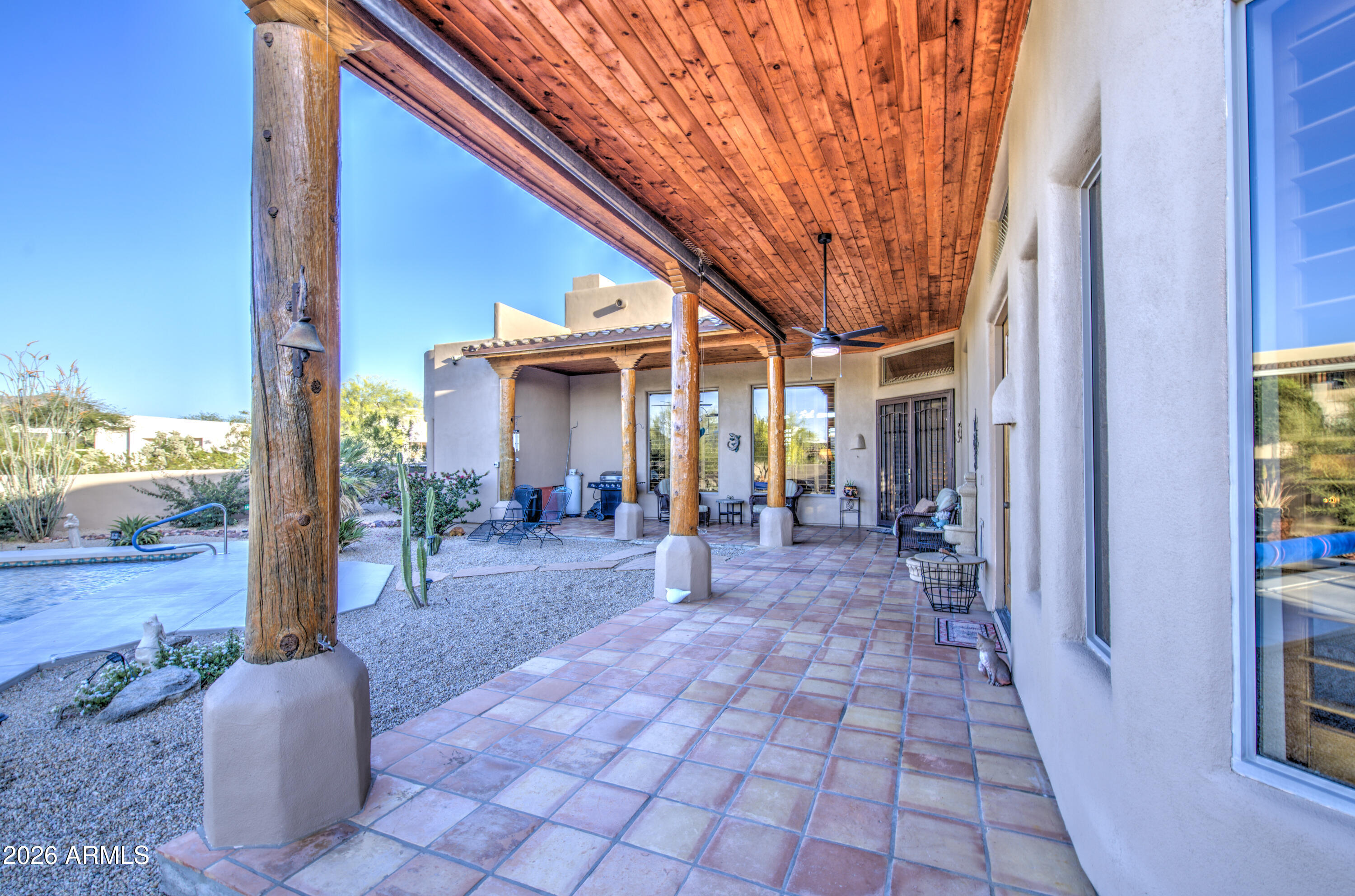 8540 East McDowell Road, Unit 122 Mesa, AZ 85207 - Photo 46 of 75 a view of a porch with chairs and potted plants