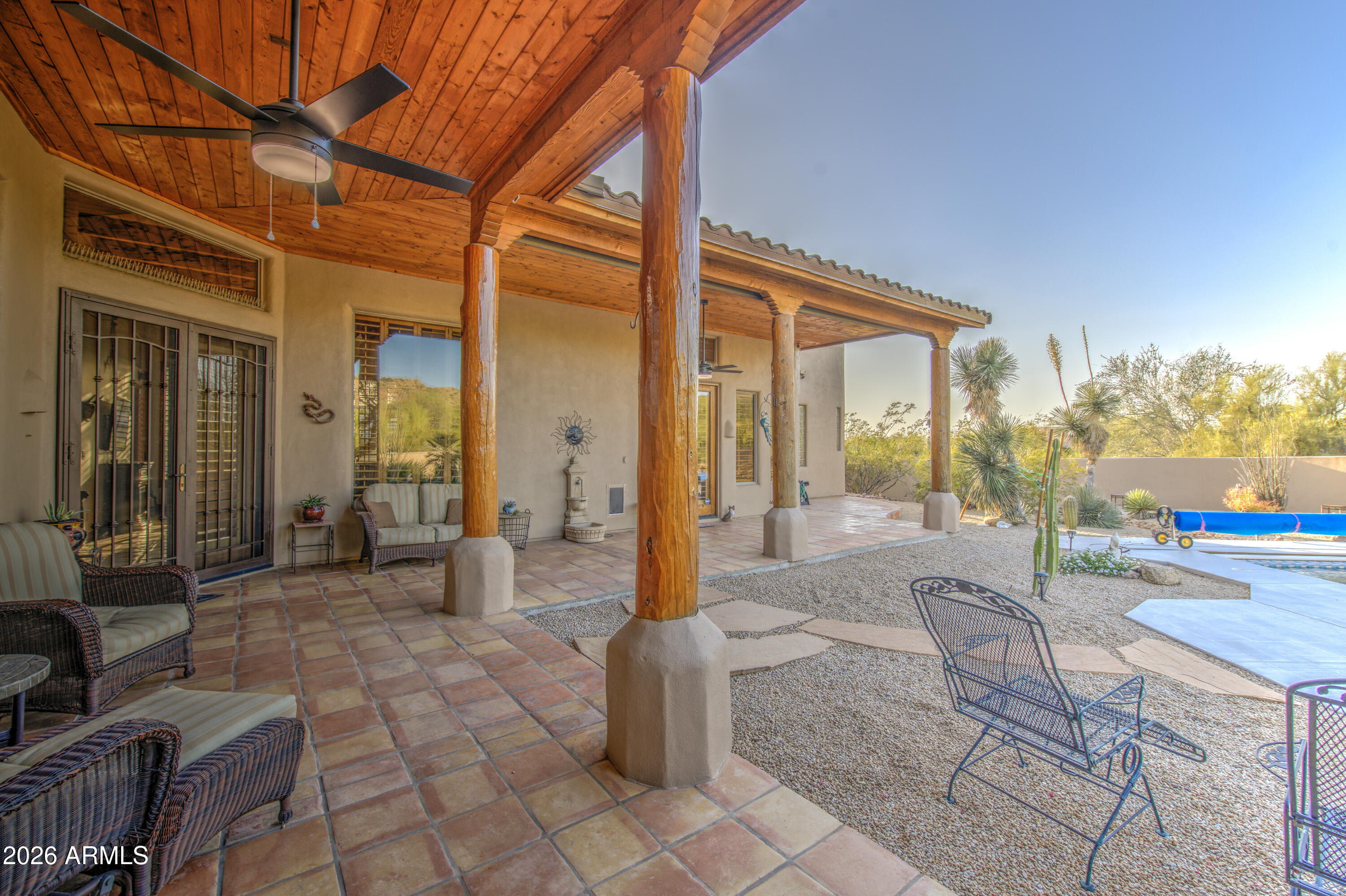 8540 East McDowell Road, Unit 122 Mesa, AZ 85207 - Photo 49 of 75 a view of a patio with table and chairs a barbeque with wooden fence