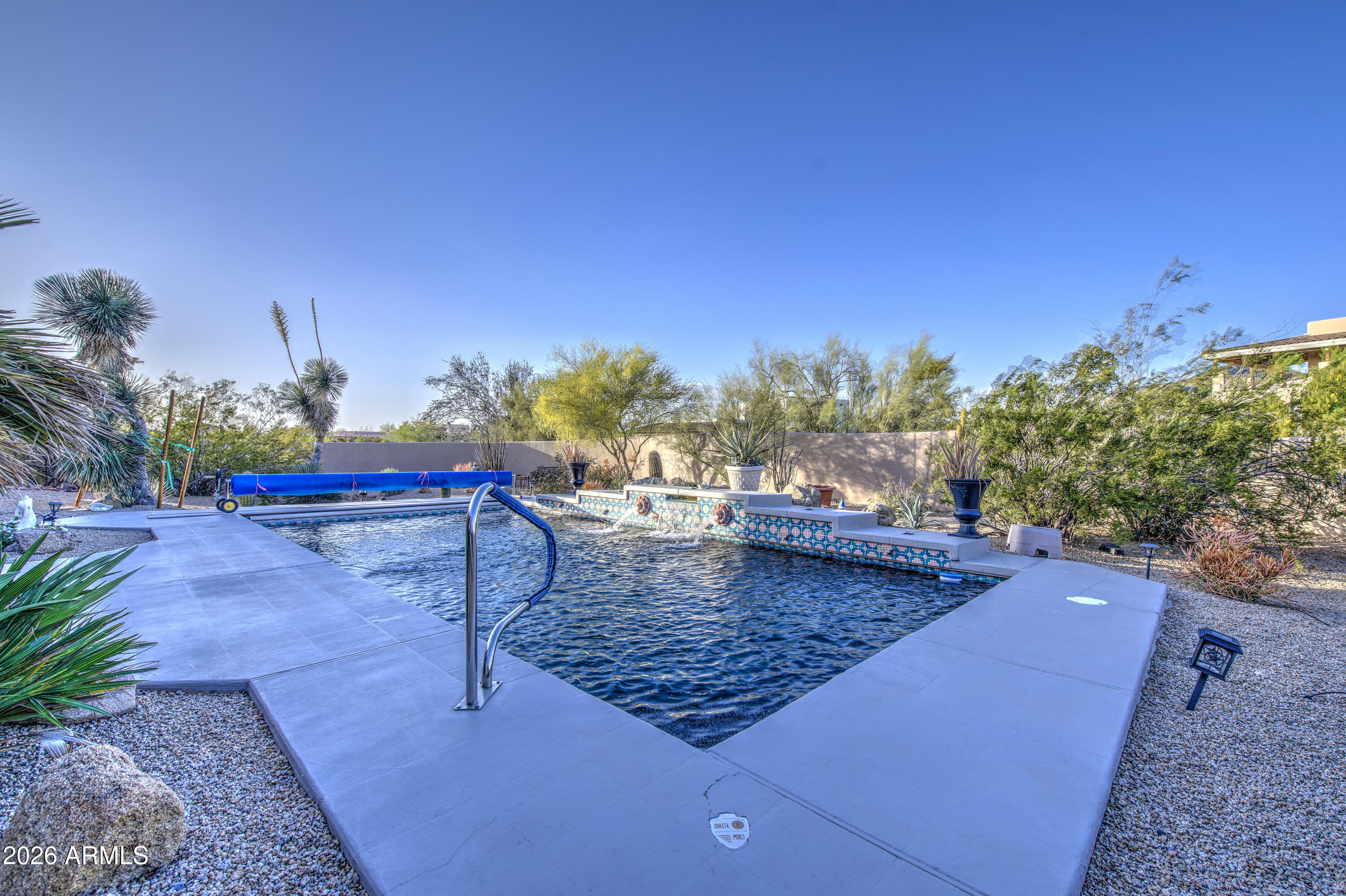 8540 East McDowell Road, Unit 122 Mesa, AZ 85207 - Photo 52 of 75 a view of a backyard and swimming pool
