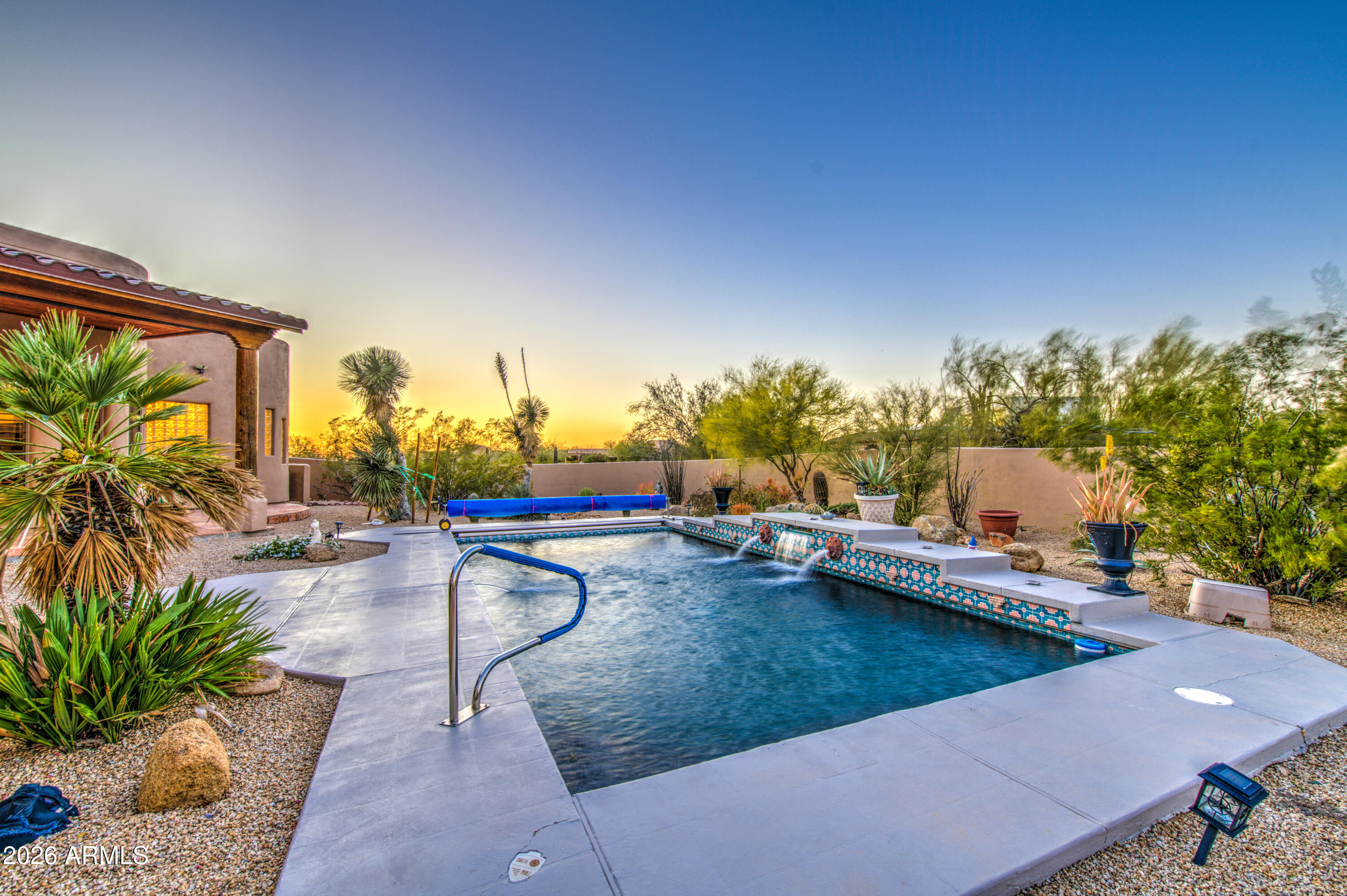 8540 East McDowell Road, Unit 122 Mesa, AZ 85207 - Photo 55 of 75 a view of a swimming pool with a patio and a yard