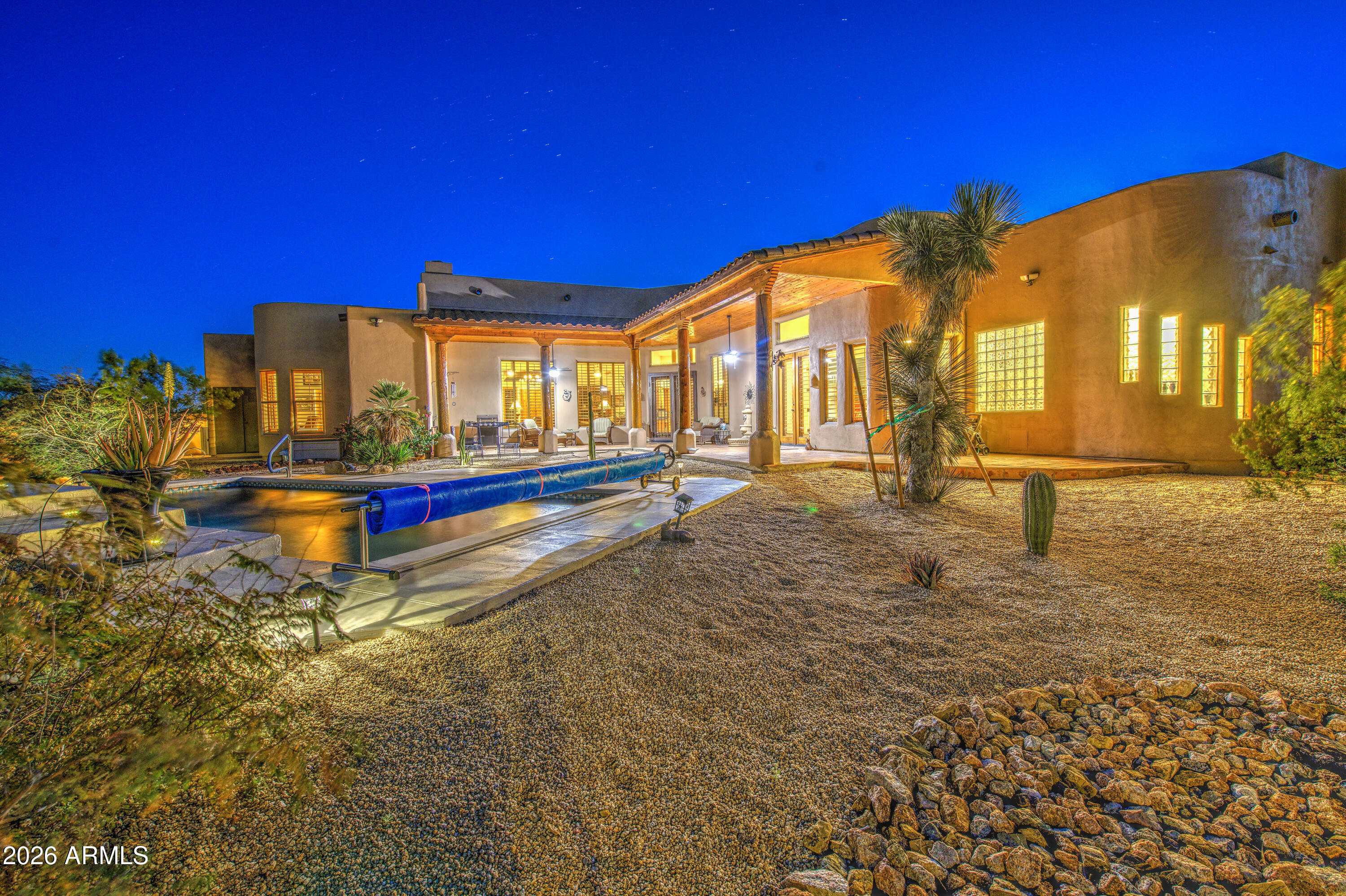 8540 East McDowell Road, Unit 122 Mesa, AZ 85207 - Photo 58 of 75 a view of a building with swimming pool and sitting area