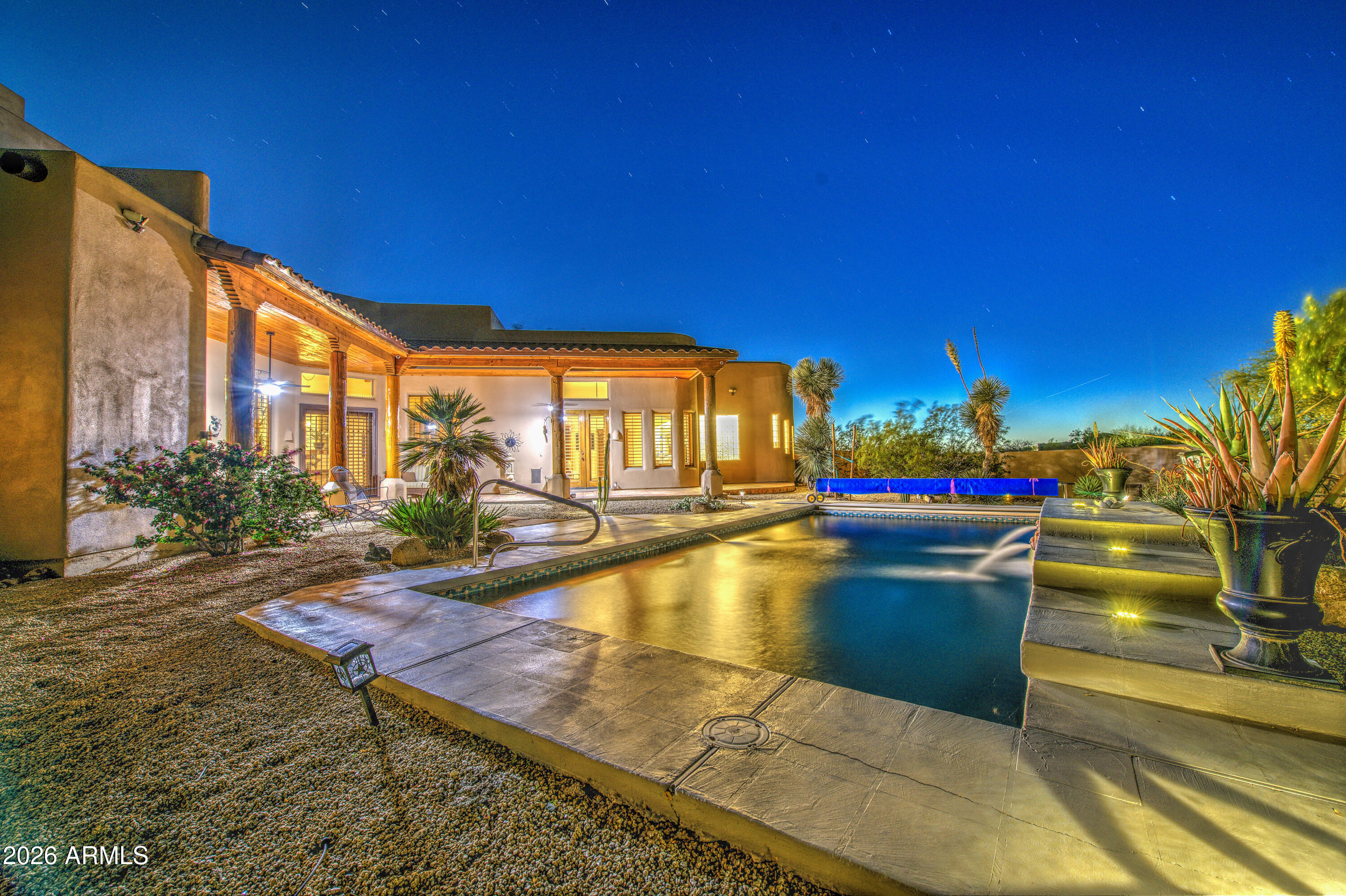 8540 East McDowell Road, Unit 122 Mesa, AZ 85207 - Photo 60 of 75 a swimming pool with outdoor seating and yard