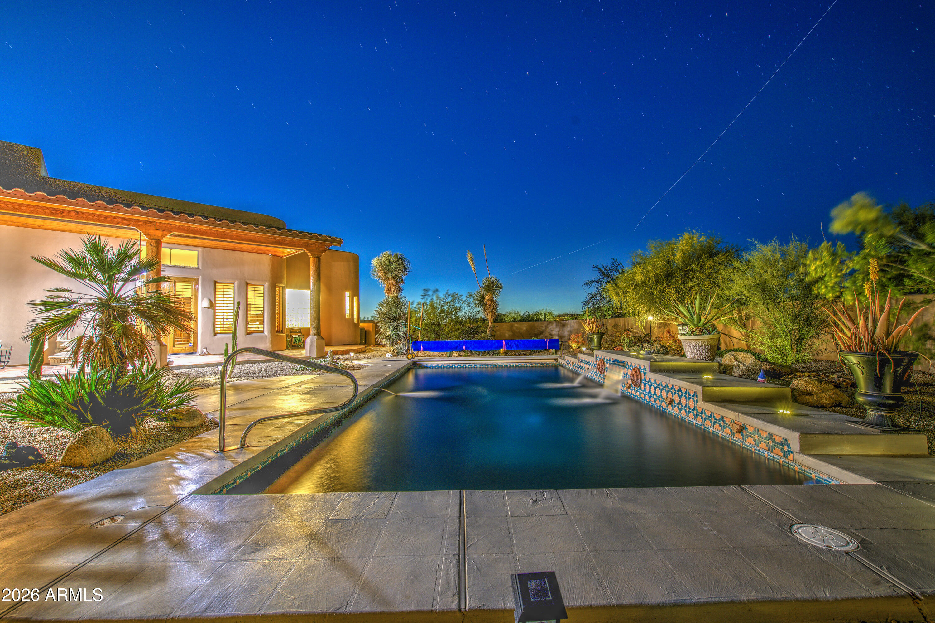 8540 East McDowell Road, Unit 122 Mesa, AZ 85207 - Photo 61 of 75 a view of a swimming pool with an outdoor seating