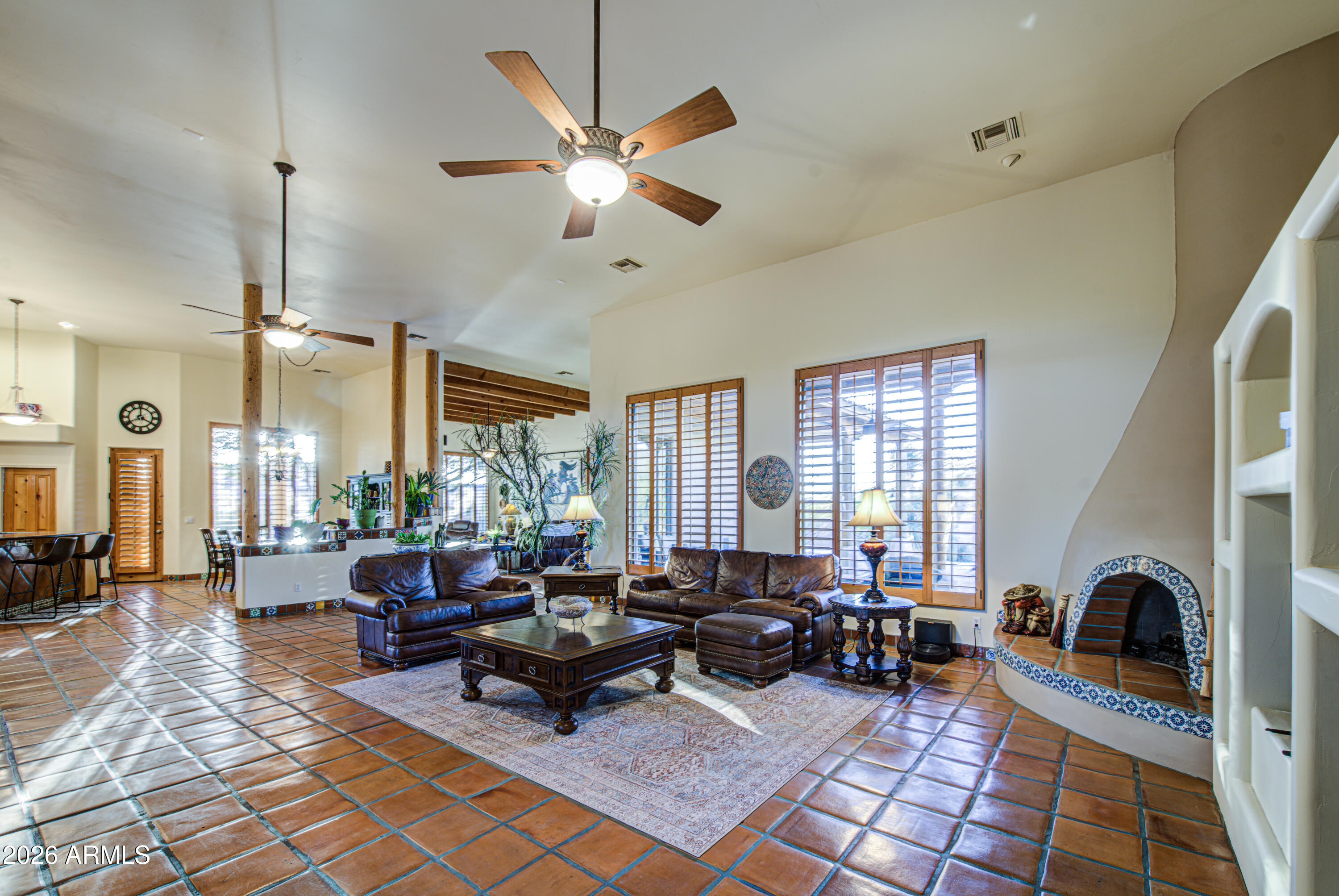 8540 East McDowell Road, Unit 122 Mesa, AZ 85207 - Photo 7 of 75 a living room with furniture fireplace and a large window