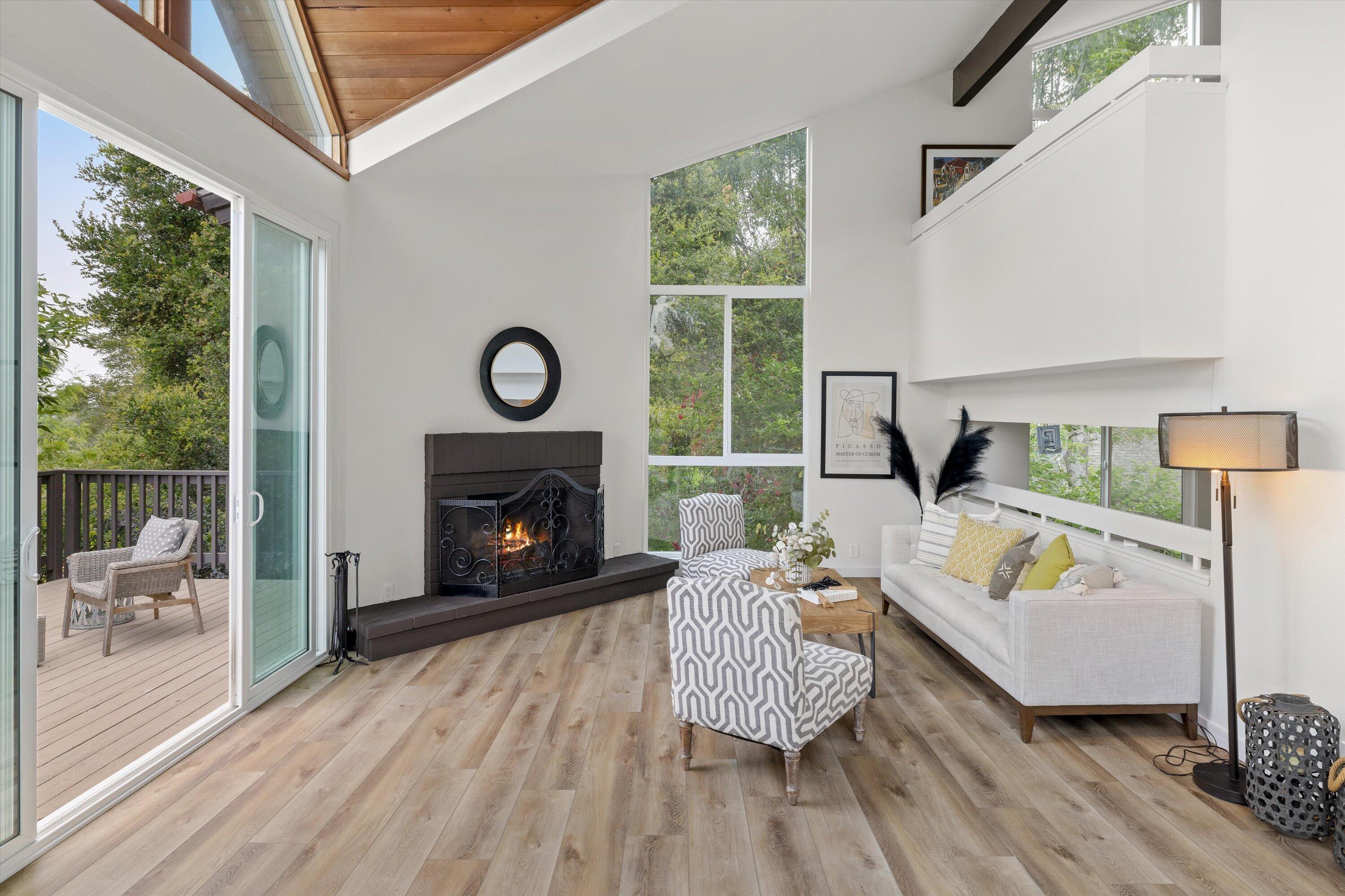 827 Cheltenham Road Santa Barbara, CA 93105 - Photo 10 of 47 a living room with furniture and a fireplace