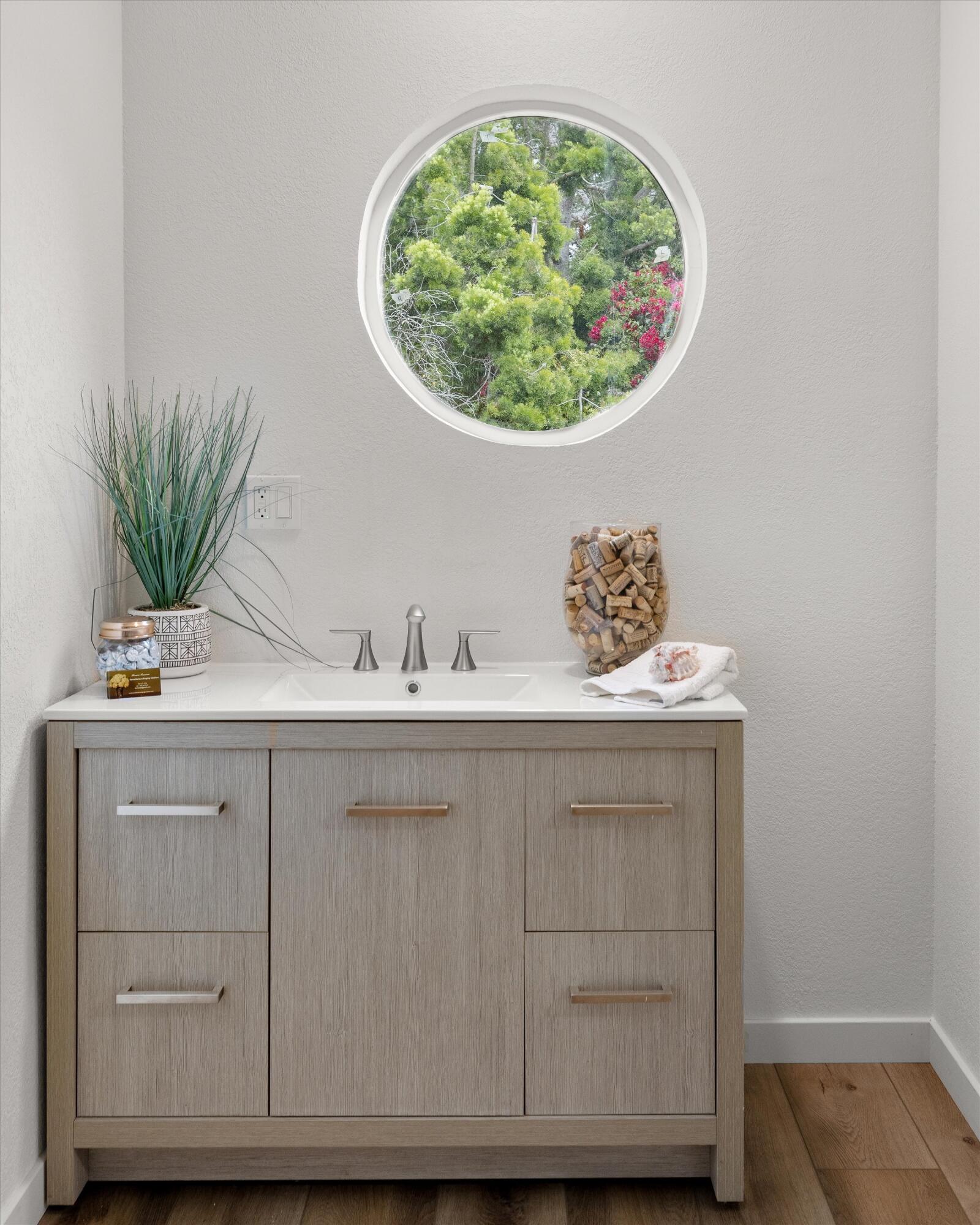 827 Cheltenham Road Santa Barbara, CA 93105 - Photo 16 of 47 a bathroom with a sink and a mirror