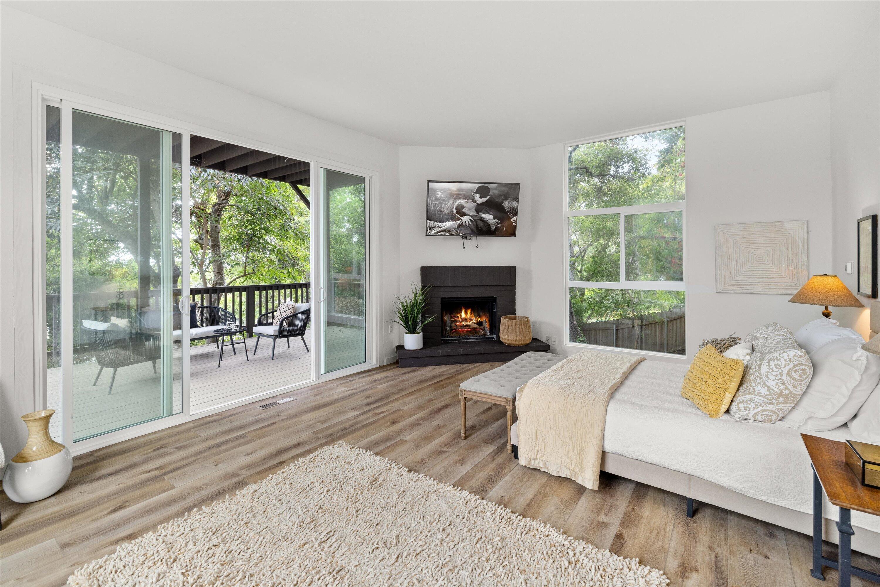 827 Cheltenham Road Santa Barbara, CA 93105 - Photo 18 of 47 a bedroom with a bed and a fireplace