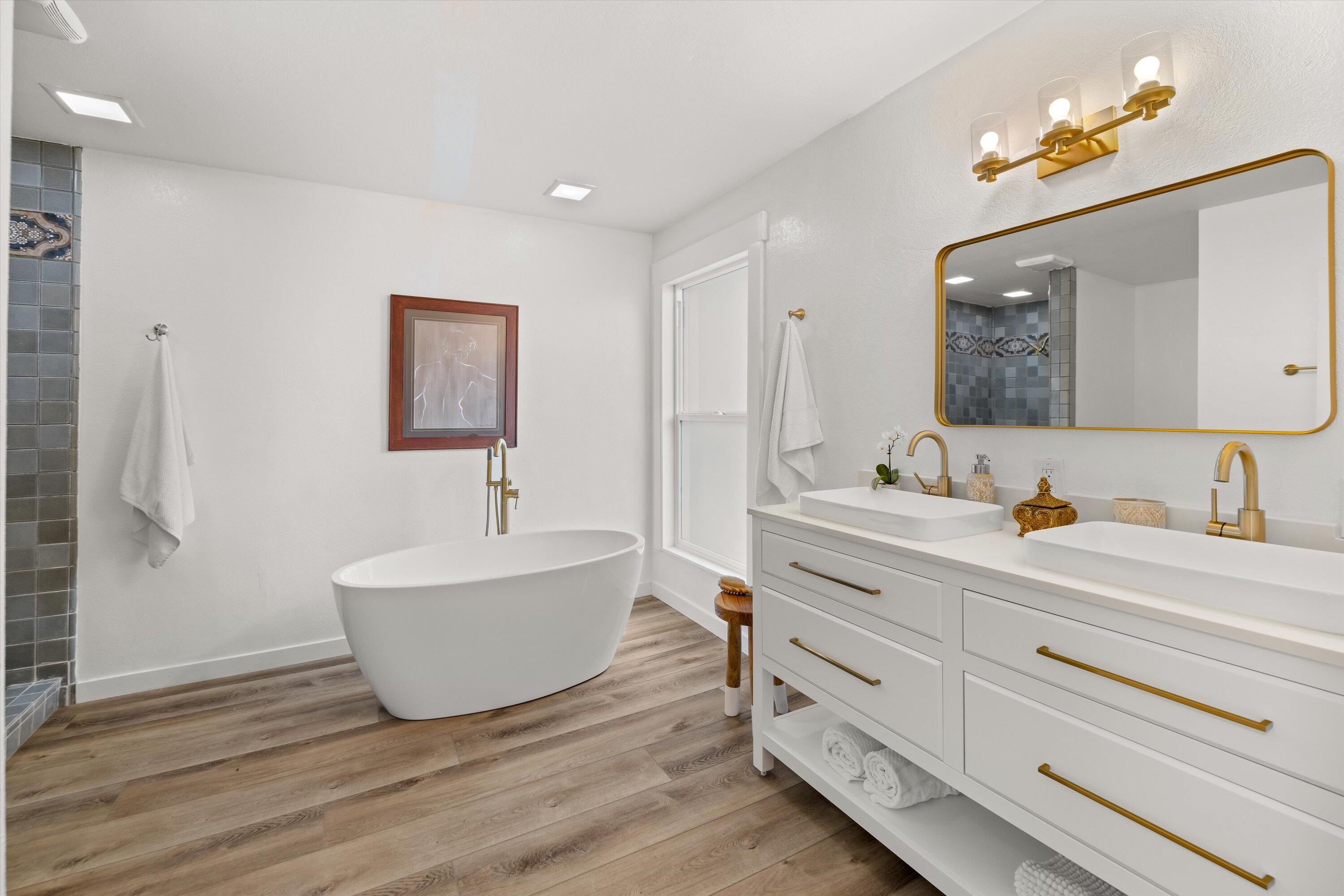 827 Cheltenham Road Santa Barbara, CA 93105 - Photo 20 of 47 a spacious bathroom with double vanity sinks a mirror and a lamp
