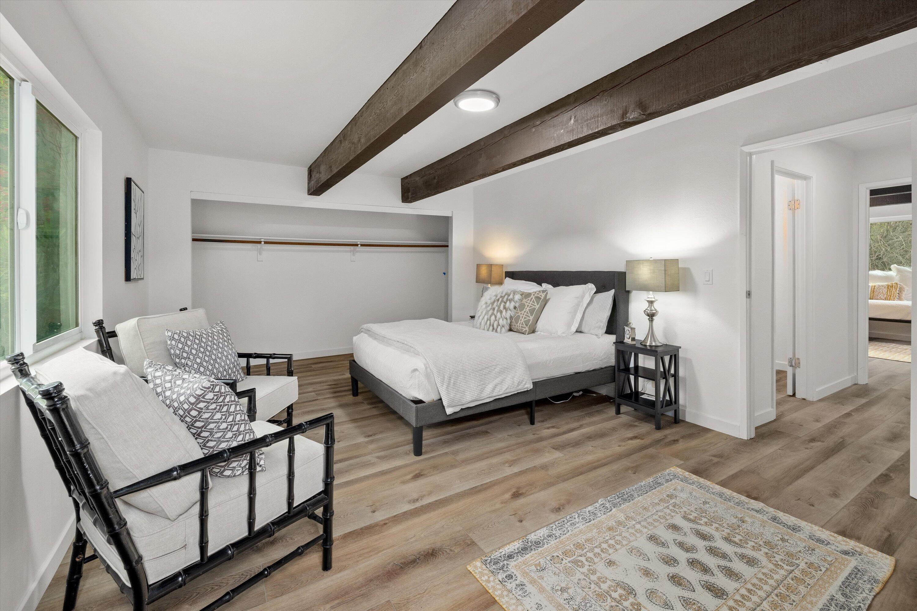 827 Cheltenham Road Santa Barbara, CA 93105 - Photo 26 of 47 a bedroom with a bed and wooden floor