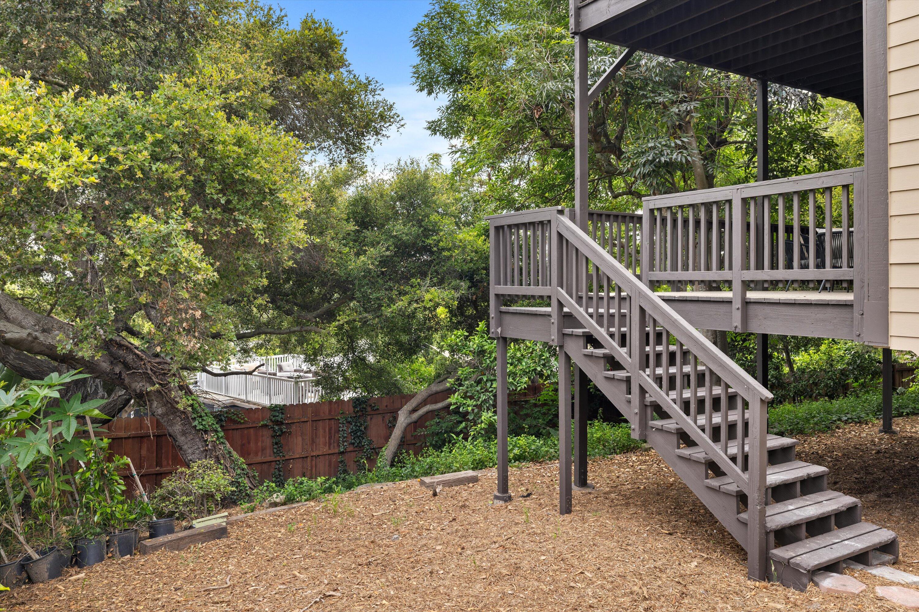 827 Cheltenham Road Santa Barbara, CA 93105 - Photo 37 of 47 a view of a house with a yard and a wooden deck