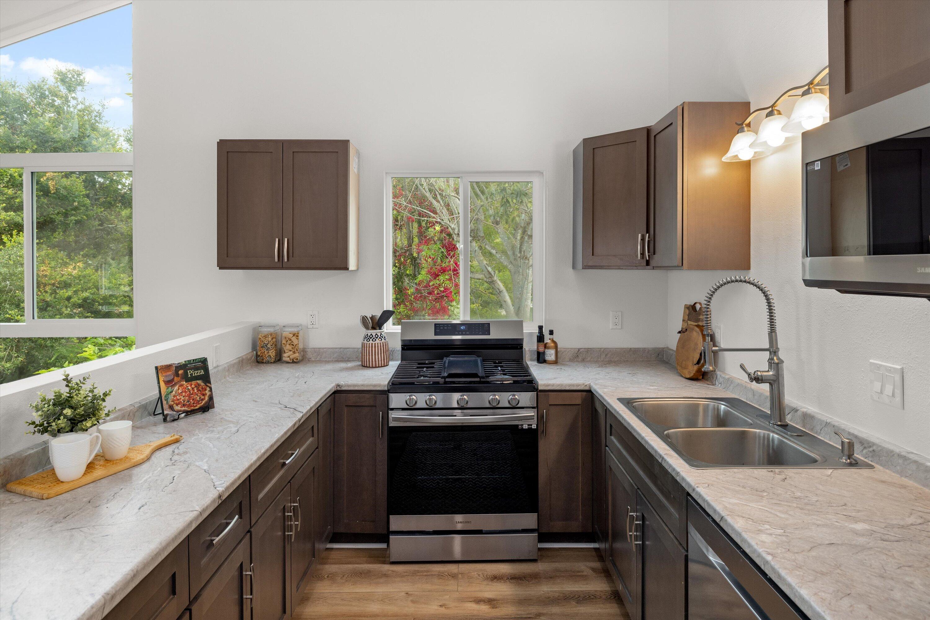 827 Cheltenham Road Santa Barbara, CA 93105 - Photo 3 of 47 a kitchen with a sink stove top oven and cabinets