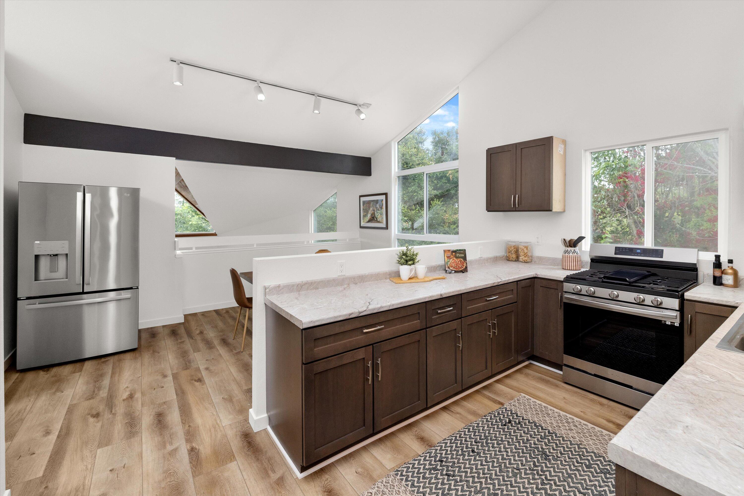 827 Cheltenham Road Santa Barbara, CA 93105 - Photo 4 of 47 a kitchen with stainless steel appliances granite countertop a sink stove and refrigerator