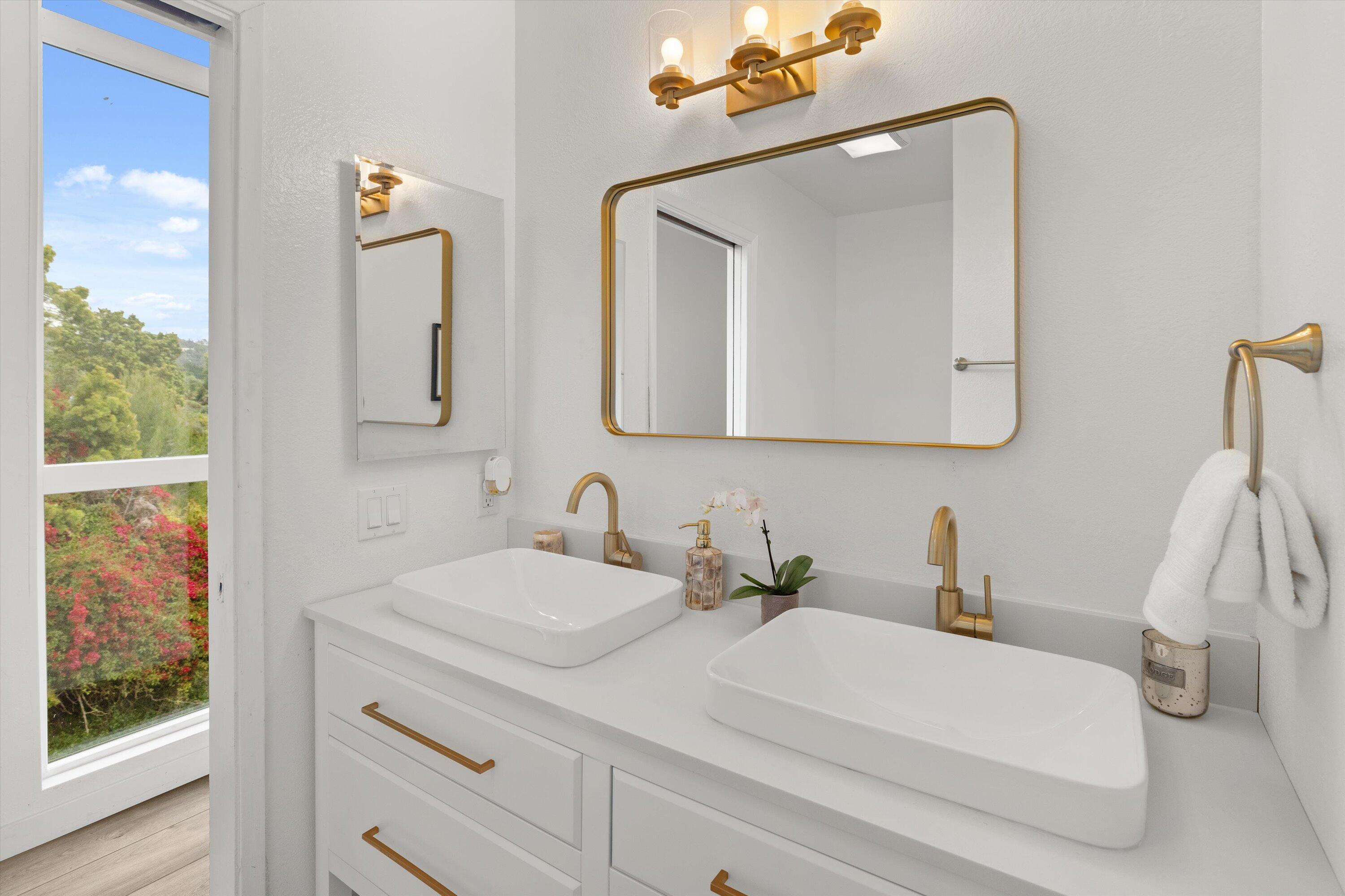 827 Cheltenham Road Santa Barbara, CA 93105 - Photo 8 of 47 a bathroom with a double vanity sink mirror and