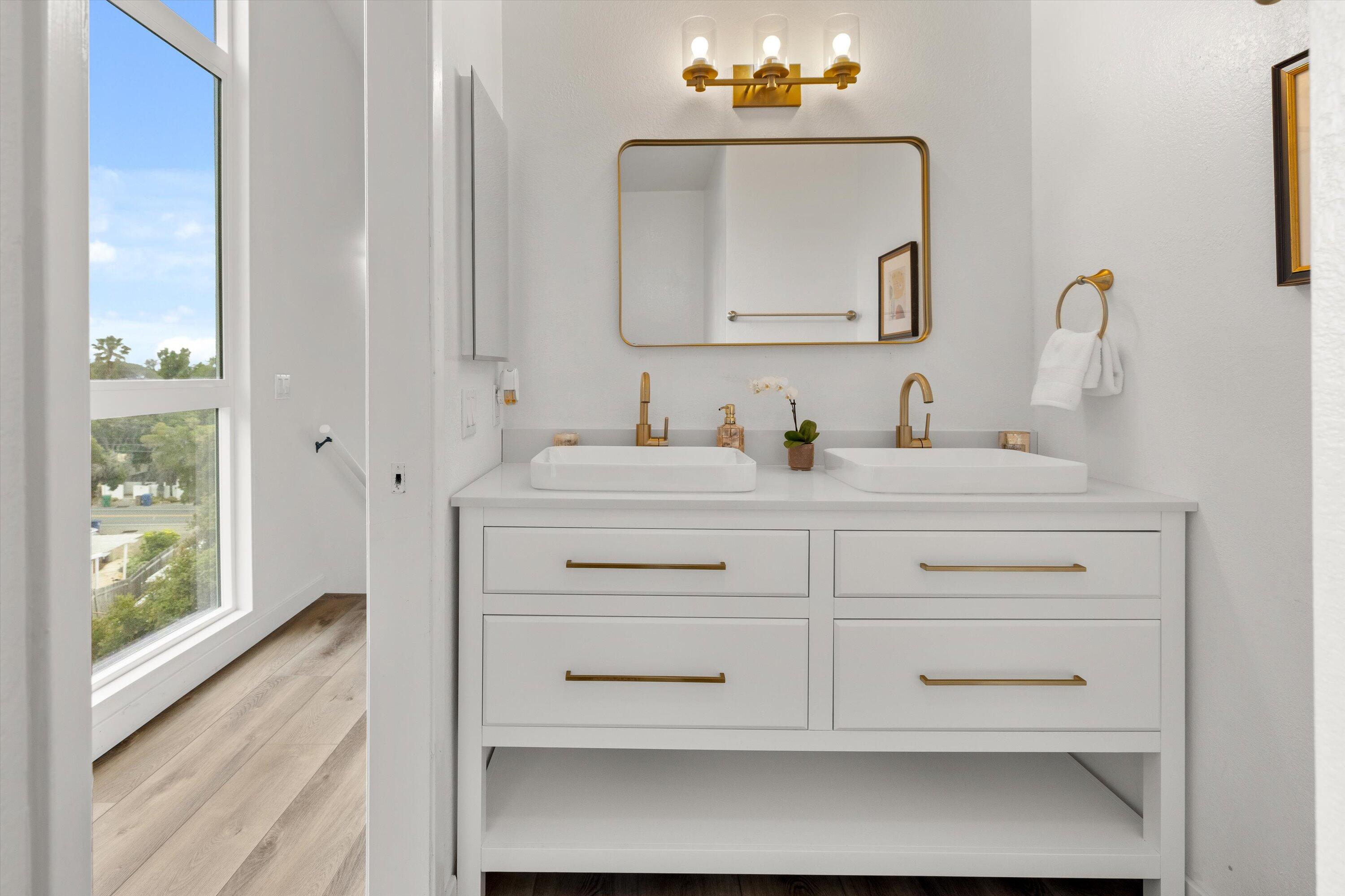 827 Cheltenham Road Santa Barbara, CA 93105 - Photo 9 of 47 a bathroom with a sink vanity and a mirror