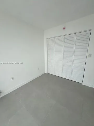 a bathroom with a sink vanity and toilet