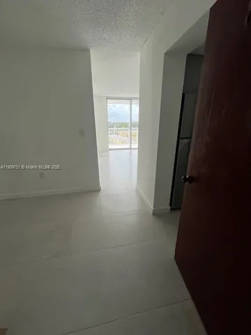 an empty room with closet area