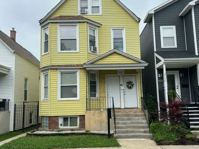 a view of small white house