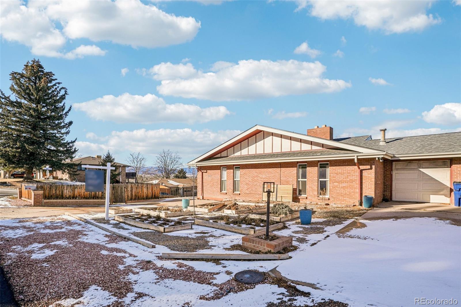 a view of a house with swimming pool and sitting area