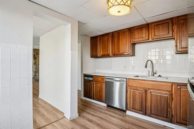 a kitchen with stainless steel appliances granite countertop a sink and cabinets