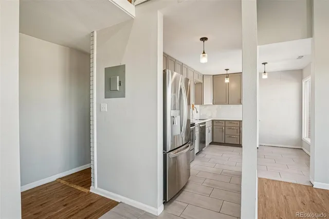 a view of a hallway with a dining room