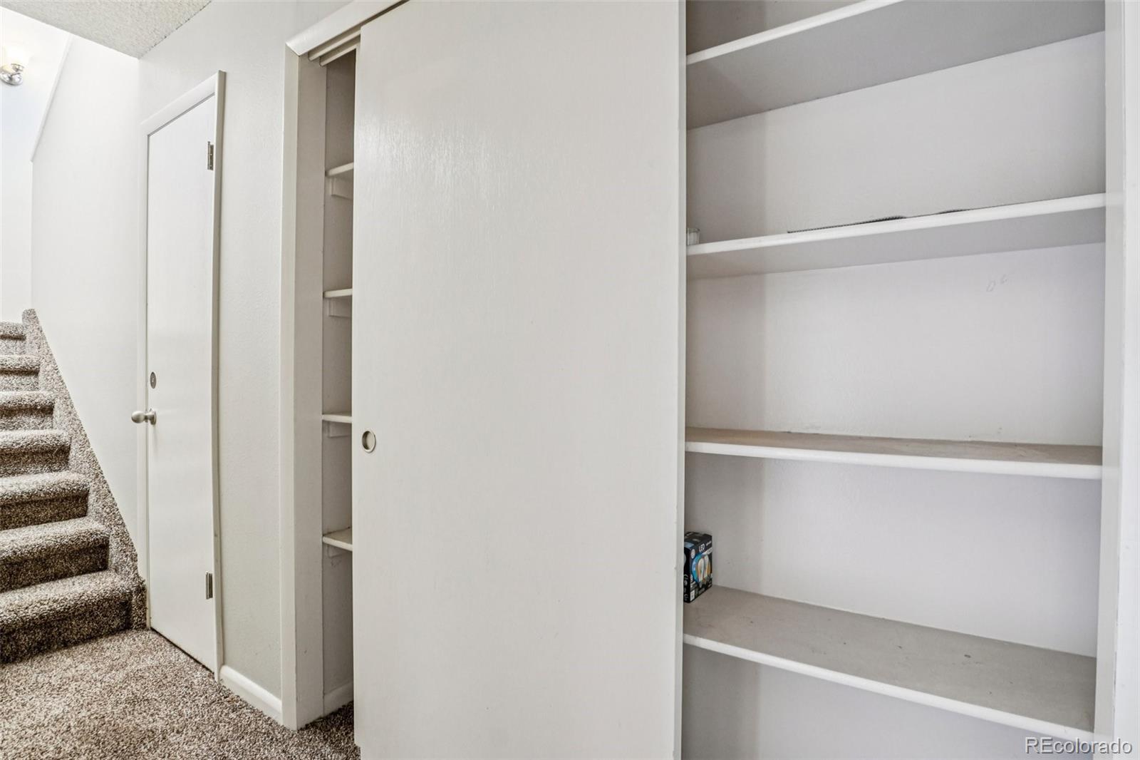 10095 West 35th Avenue Wheat Ridge, CO 80033 - Photo 32 of 50 a view of walk in closet with empty racks