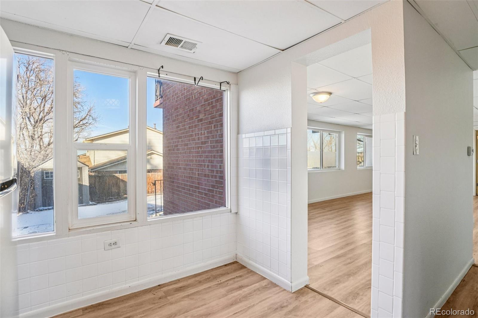 10095 West 35th Avenue Wheat Ridge, CO 80033 - Photo 34 of 50 a view of a hallway with wooden floor and windows