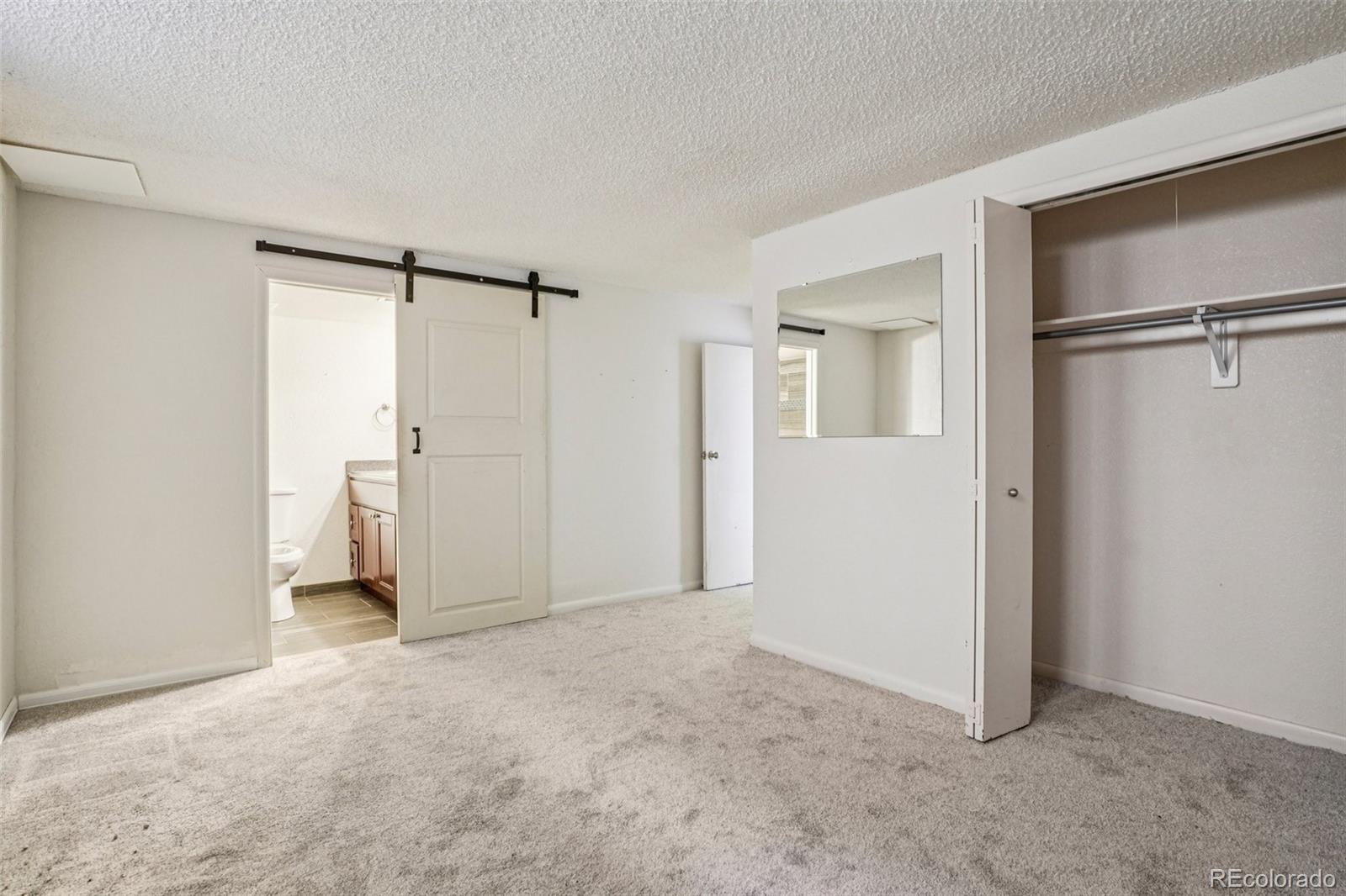 10095 West 35th Avenue Wheat Ridge, CO 80033 - Photo 35 of 50 a view of empty room with wooden floor and a ceiling fan