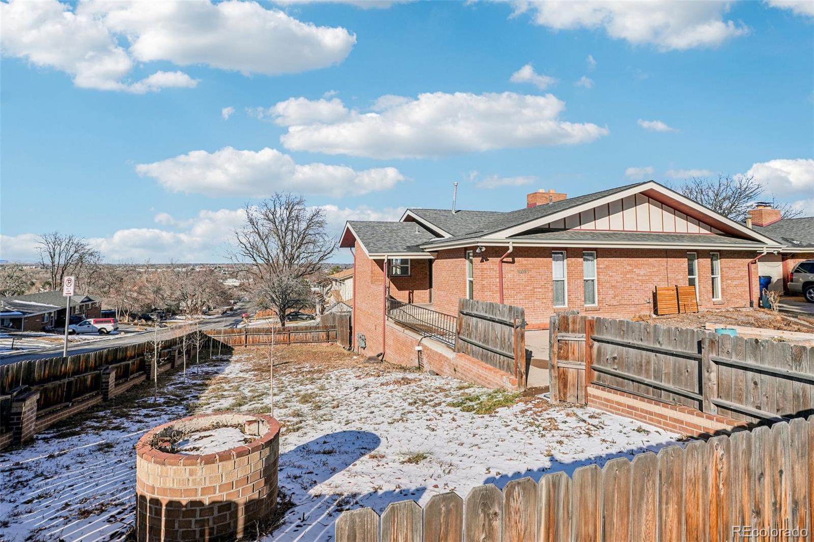 10095 West 35th Avenue Wheat Ridge, CO 80033 - Photo 44 of 50 a view of a roof deck with chair and tables