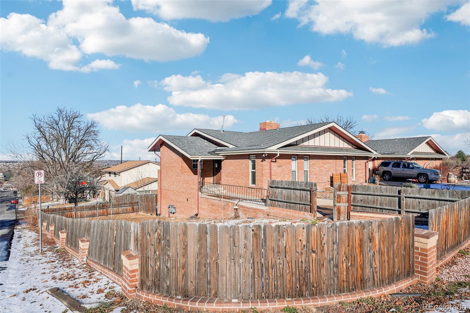 10095 West 35th Avenue Wheat Ridge, CO 80033 - Photo 45 of 50 a front view of a house with a yard