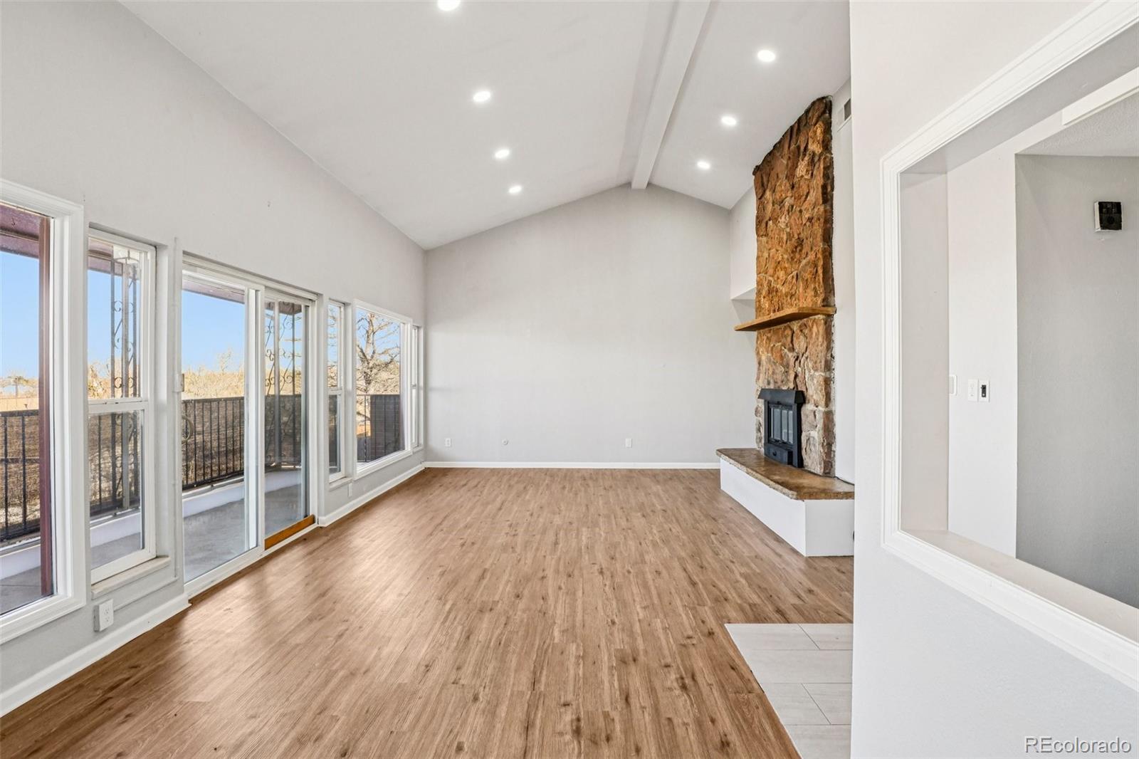 10095 West 35th Avenue Wheat Ridge, CO 80033 - Photo 5 of 50 wooden floor in an empty room with a window
