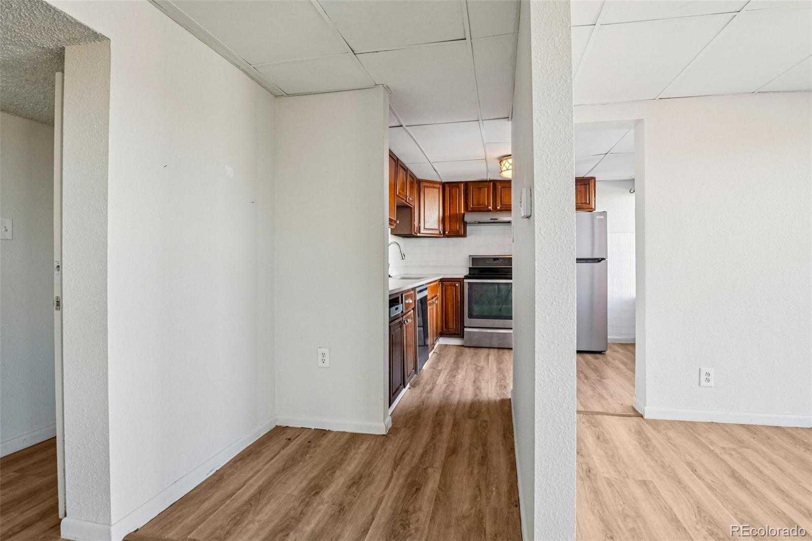 10095 West 35th Avenue Wheat Ridge, CO 80033 - Photo 10 of 50 a view of a kitchen from the hallway