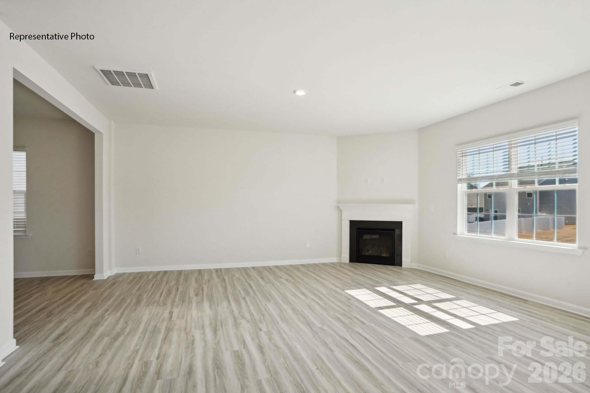 2015 Moorside Court Lancaster, SC 29720 - Photo 13 of 46 a view of empty room with wooden floor and a window