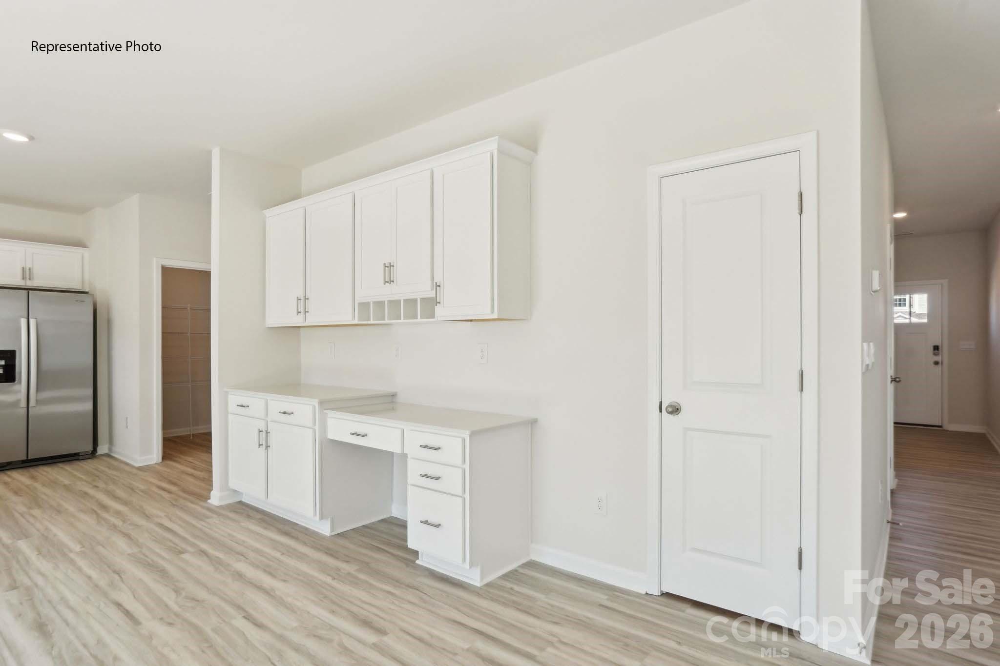 2015 Moorside Court Lancaster, SC 29720 - Photo 16 of 46 a kitchen with white cabinets and wooden floor