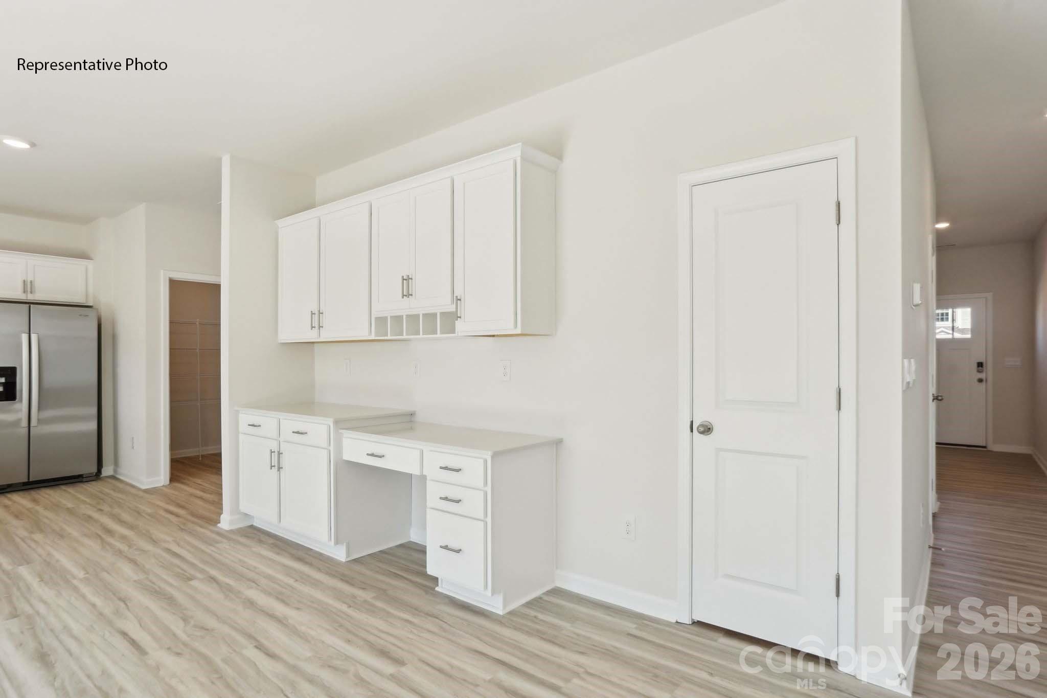 2015 Moorside Court Lancaster, SC 29720 - Photo 17 of 46 a kitchen with white cabinets and wooden floor