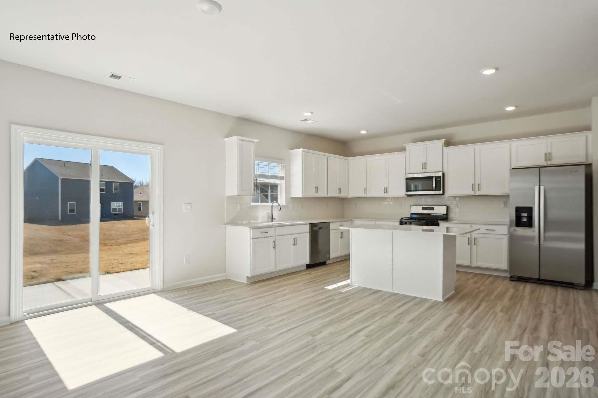 2015 Moorside Court Lancaster, SC 29720 - Photo 19 of 46 a kitchen with white cabinets and white appliances