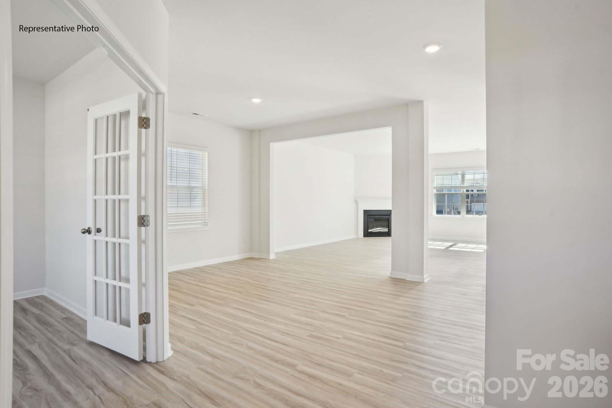 2015 Moorside Court Lancaster, SC 29720 - Photo 2 of 46 a view of an empty room with wooden floor and a window