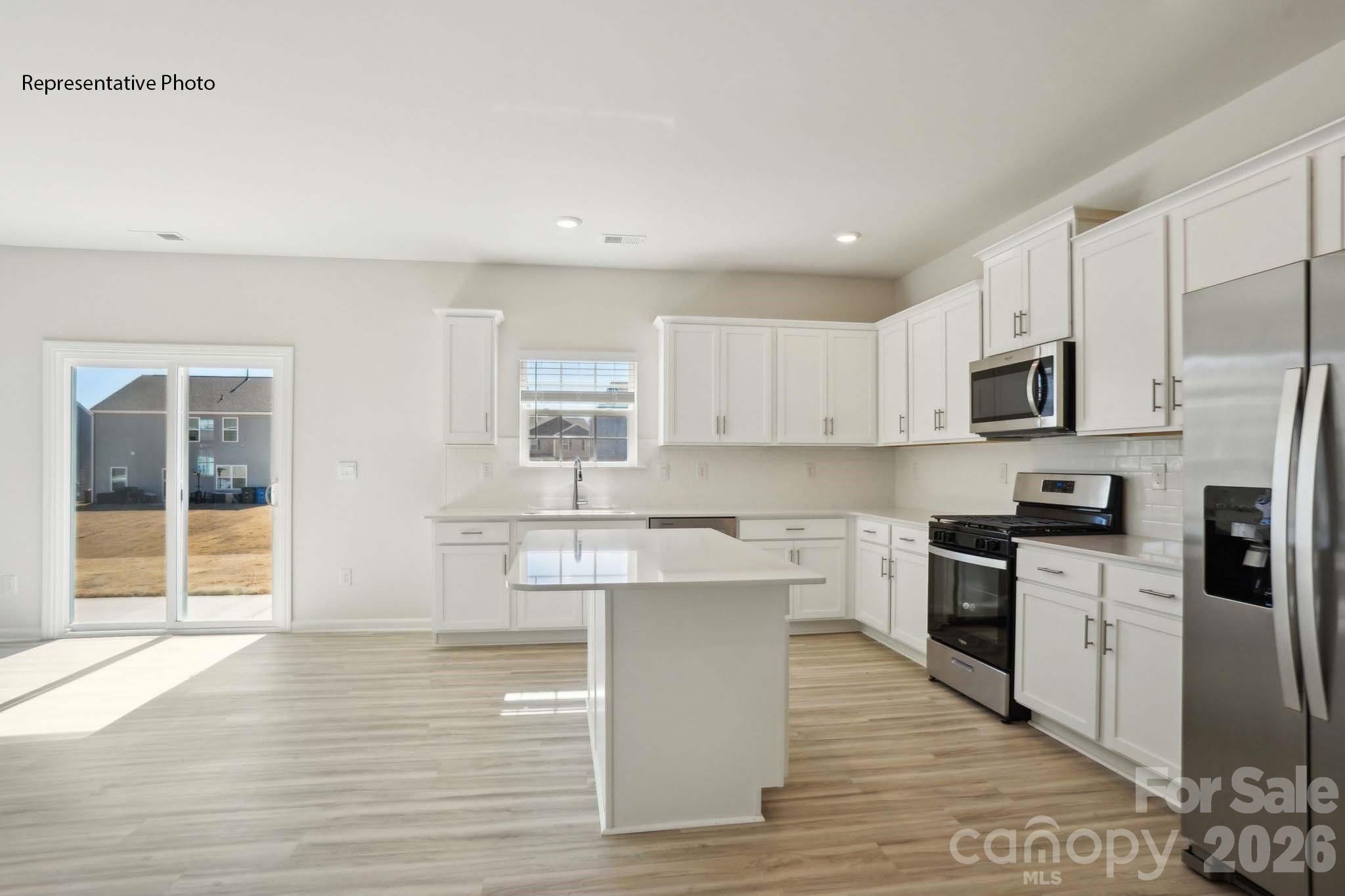 2015 Moorside Court Lancaster, SC 29720 - Photo 23 of 46 a kitchen with white cabinets stainless steel appliances and sink