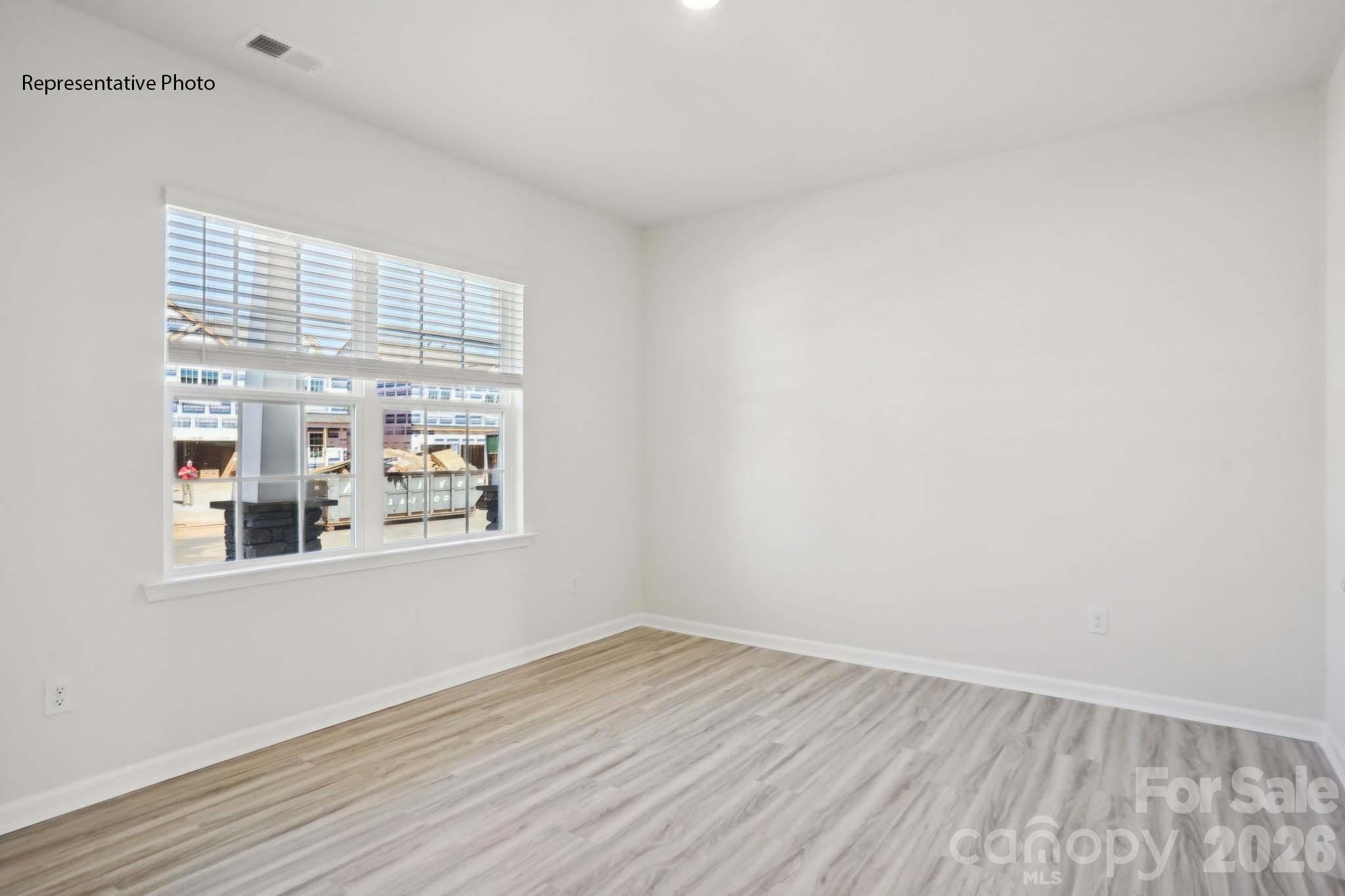 2015 Moorside Court Lancaster, SC 29720 - Photo 25 of 46 an empty room with wooden floor and windows