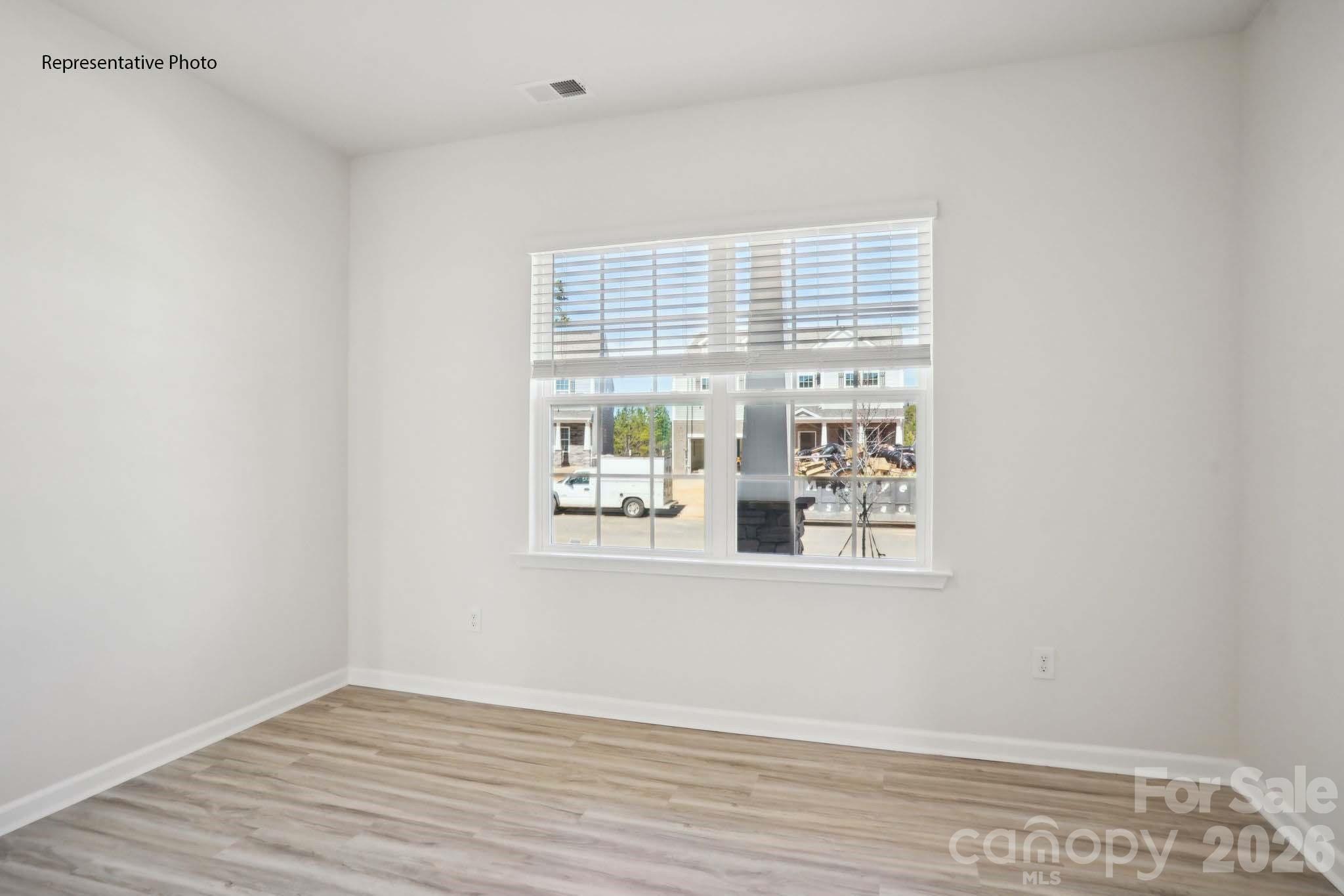 2015 Moorside Court Lancaster, SC 29720 - Photo 26 of 46 a view of an empty room with wooden floor and a window