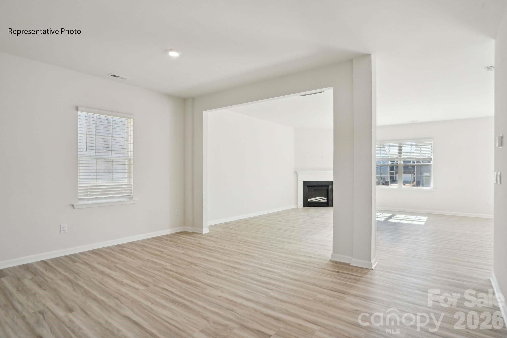 2015 Moorside Court Lancaster, SC 29720 - Photo 5 of 46 a view of an empty room with wooden floor and a window