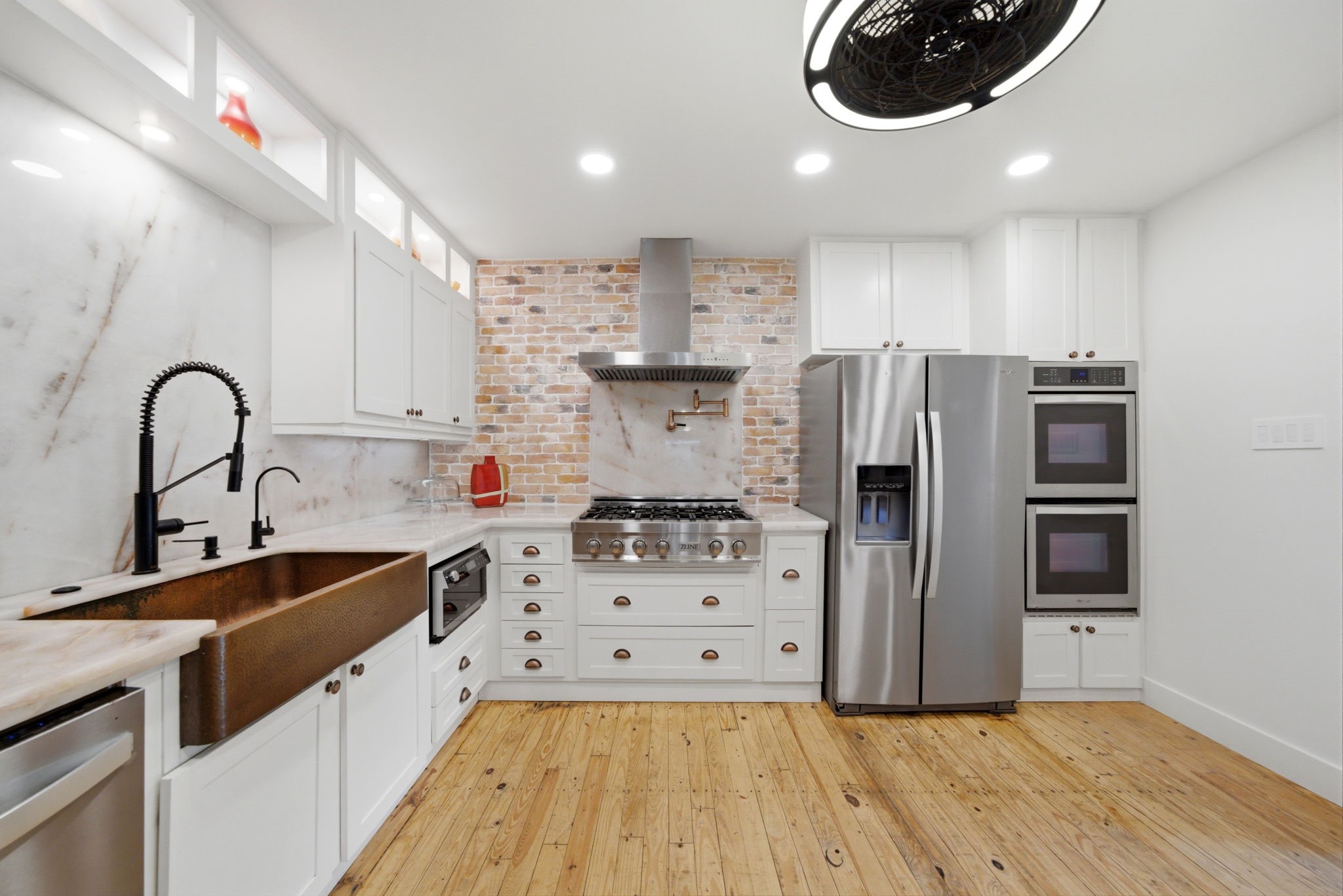 3128 Prospect Street Houston, TX 77004 - Photo 11 of 36 a kitchen with stainless steel appliances a stove a sink a refrigerator and cabinets