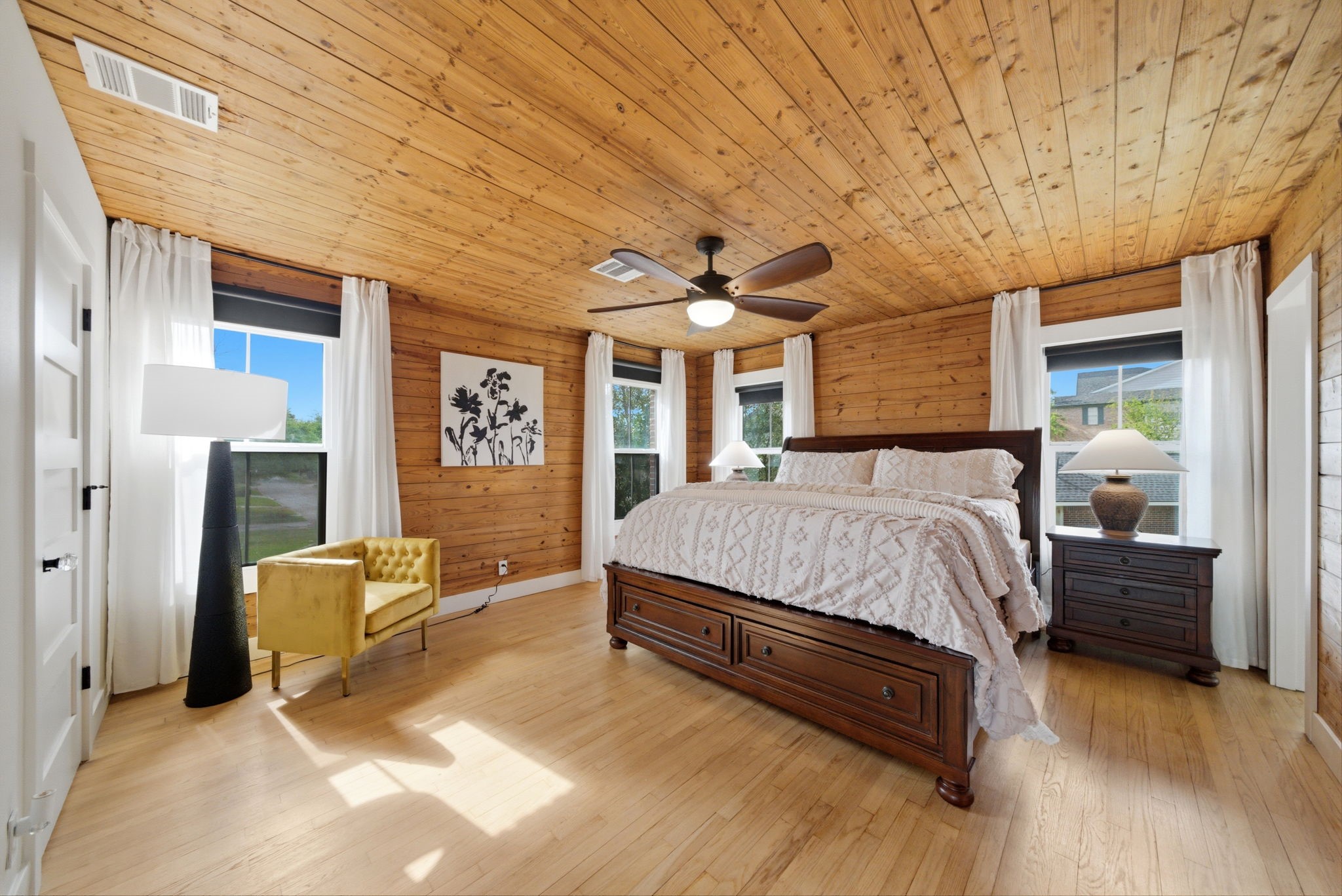3128 Prospect Street Houston, TX 77004 - Photo 21 of 36 a spacious bedroom with a bed and wooden floor