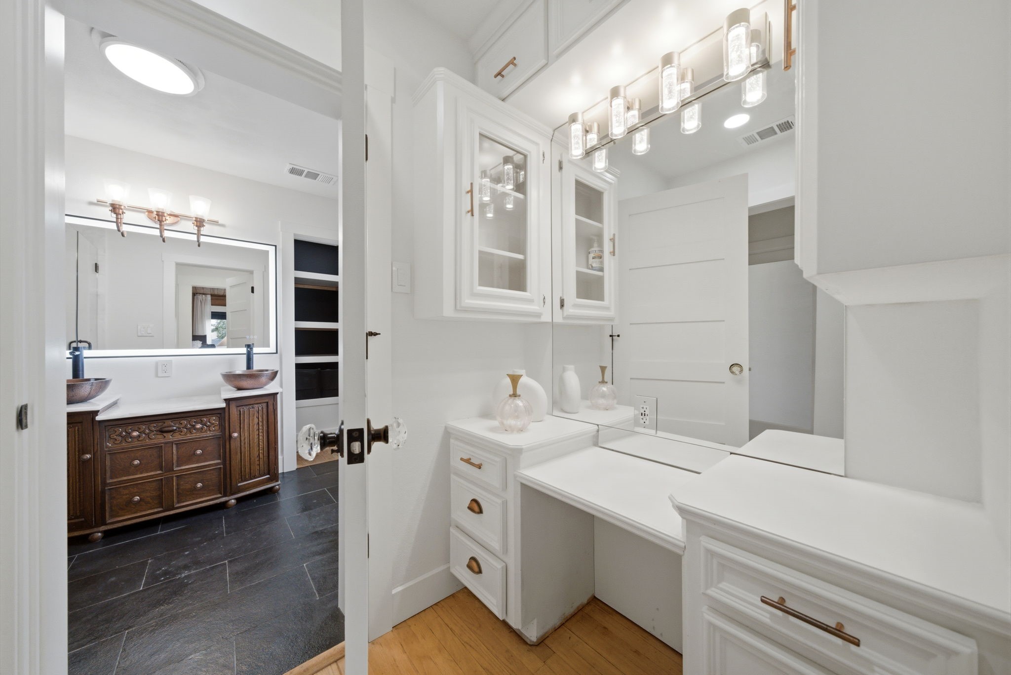 3128 Prospect Street Houston, TX 77004 - Photo 22 of 36 a bathroom with a sink vanity granite tub and a mirror