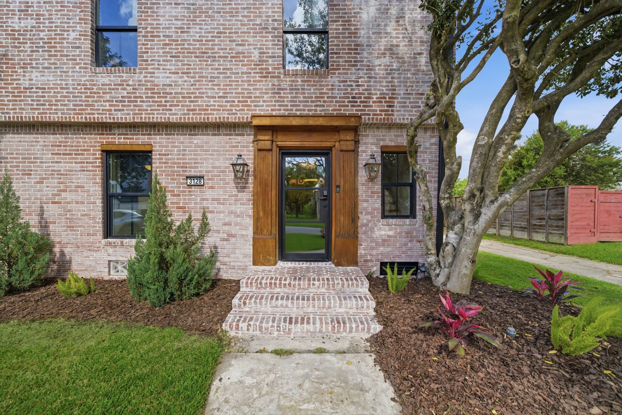 3128 Prospect Street Houston, TX 77004 - Photo 3 of 36 a front view of a house with garden